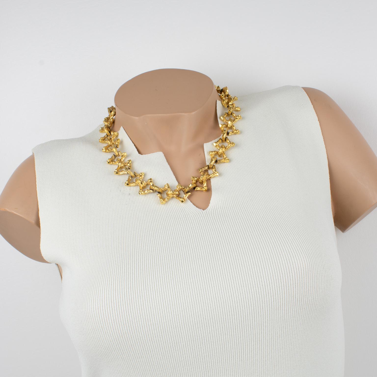 This lovely French designer Guy Laroche Paris choker necklace features a dimensional brutalist shape, with gilt metal all textured. The choker has a toggle closing clasp and is signed on the underside near the fastening Guy Laroche - Paris.
The