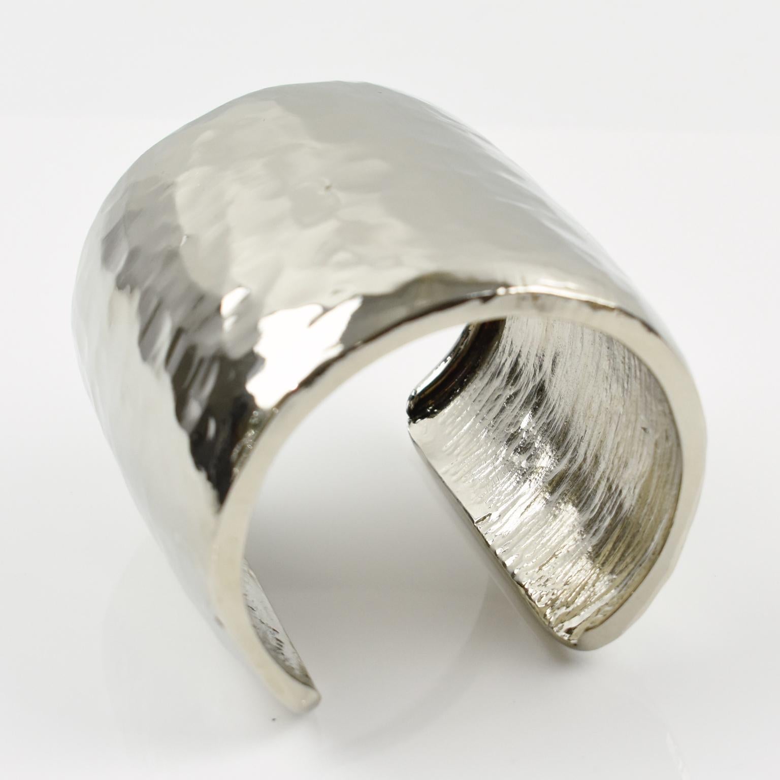 Stunning Guy Laroche Paris signed cuff bracelet. Brutalist oversized cuff design with hand-made feel, silvered metal extremely shiny with slightly hammered finish. Engraved signature underside: 'Guy Laroche - Paris'.
Measurements: inside across is