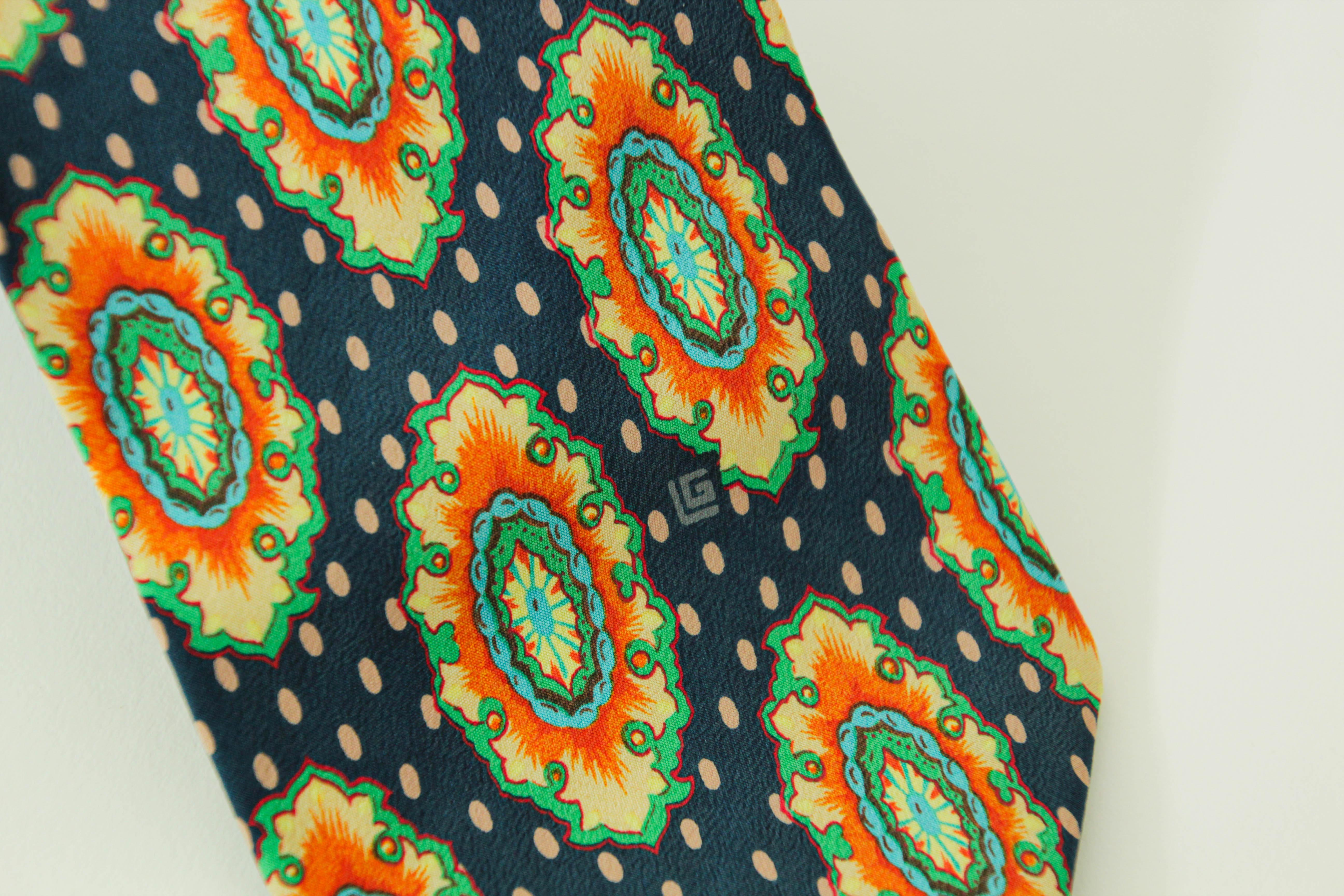 Guy Laroche Paris silk tie men dress necktie.
Guy Laroche Paris tie fancy printed silk, hand made.
The tie is crafted in bold orange yellow blue and tan silk, the tie will elegantly embellish any suit.
Dress luxury silk necktie designed by GUY
