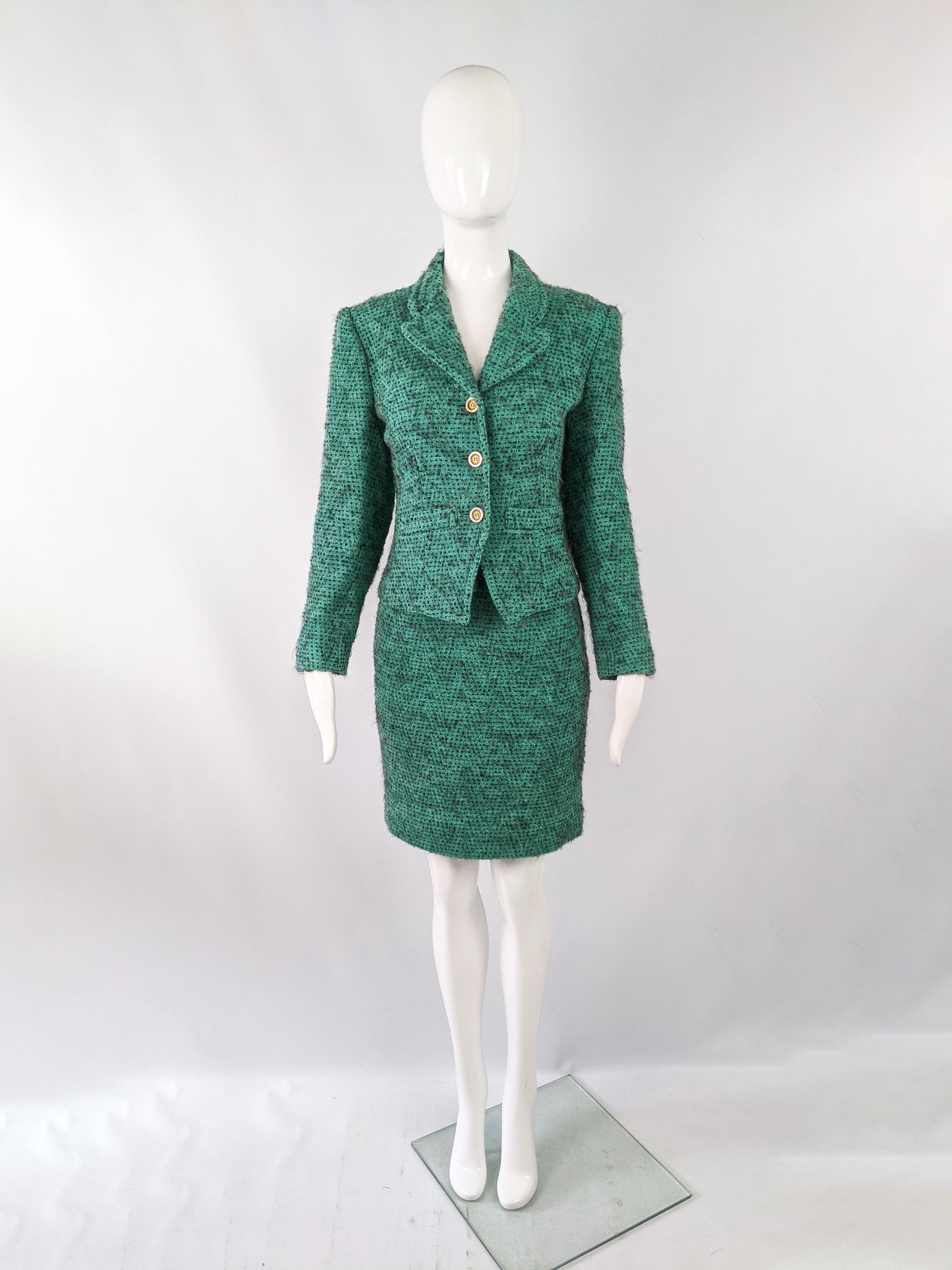 A chic vintage womens two piece skirt suit from the 80s by luxury French fashion designer, Guy Laroche. In a green fuzzy wool boucle tweed with a sharp, tailored look and statement buttons.  

Size: Marked vintage FR 34 but measures roughly like a