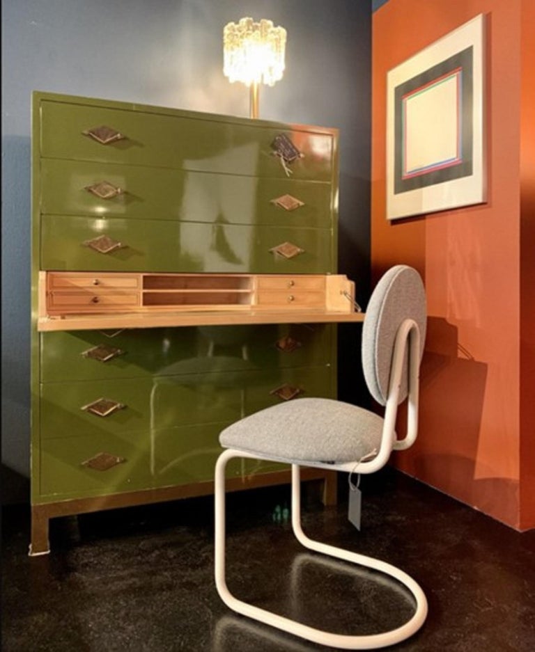 One of a Kind design piece, exclusive for its shapes, size, finish and colour. It is a tall chest of drawers or secretaire made of chartreuse or Carthusian green lacquered wood, a 1970s design by Guy Lefèvre for the luxurious and exquisite French