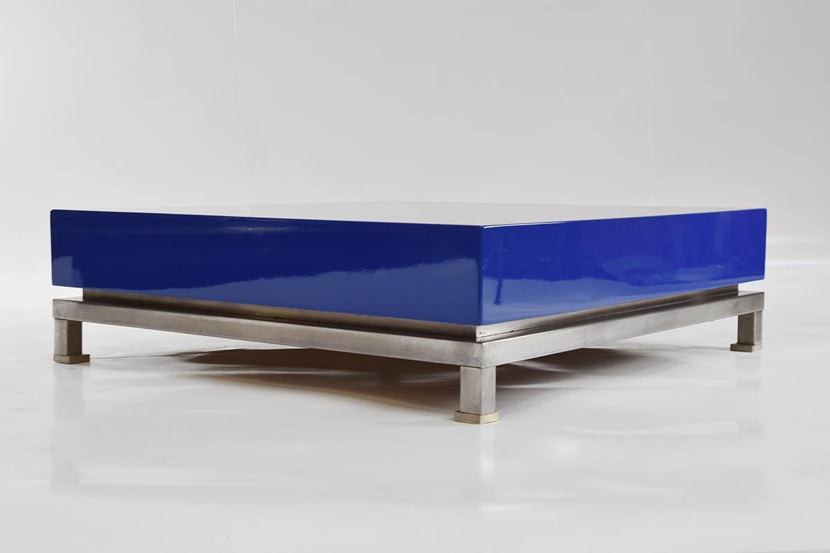 Very rare and outstanding coffee table designed by Guy Lefèvre for Maison Jansen in the 1970s. The nickeled and brass base have a used patina, the blue lacquer is in a perfect condition.