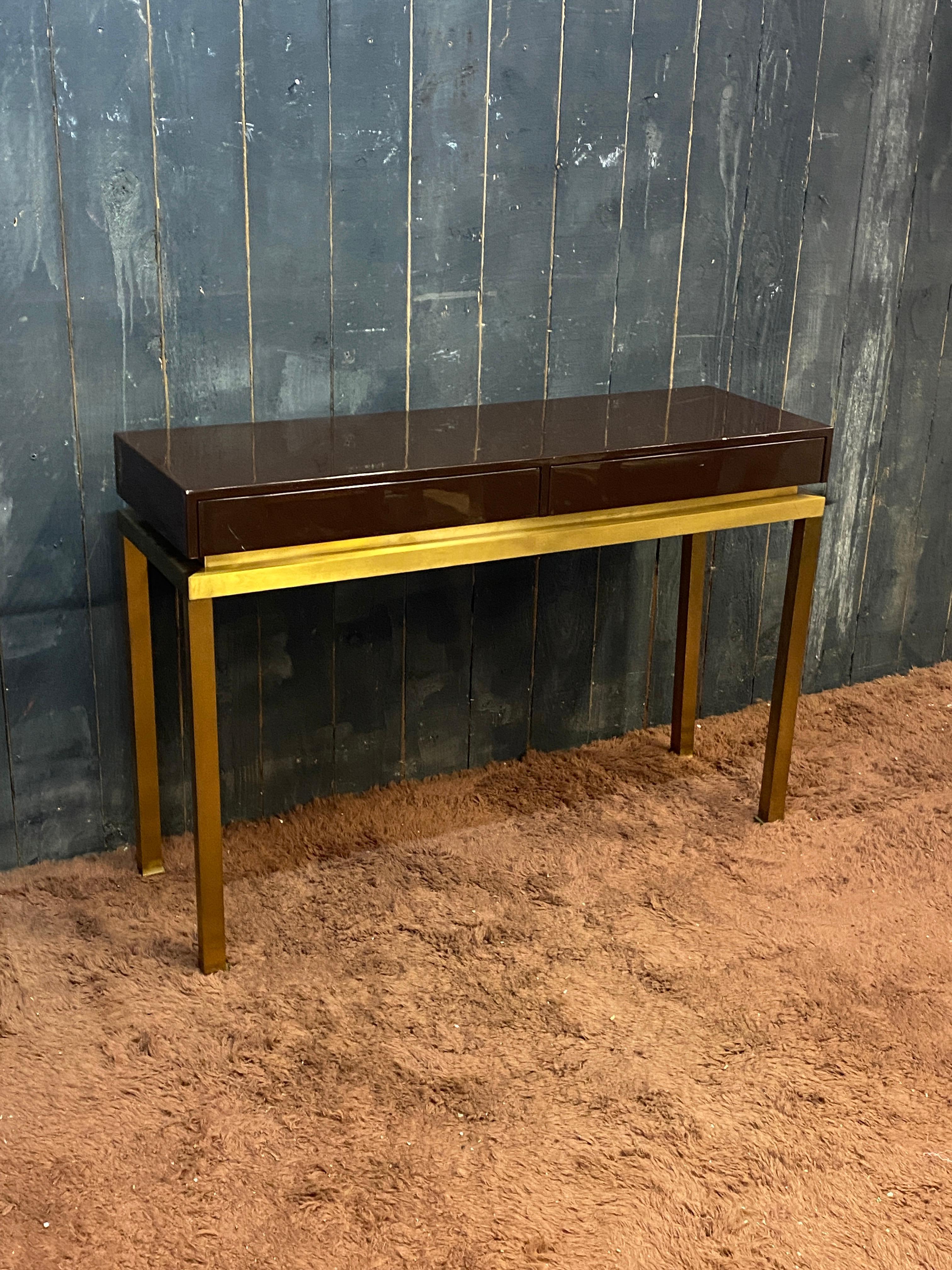 Guy Lefevre, elegant console in lacquered wood and brass, opening with two drawers, circa 1970