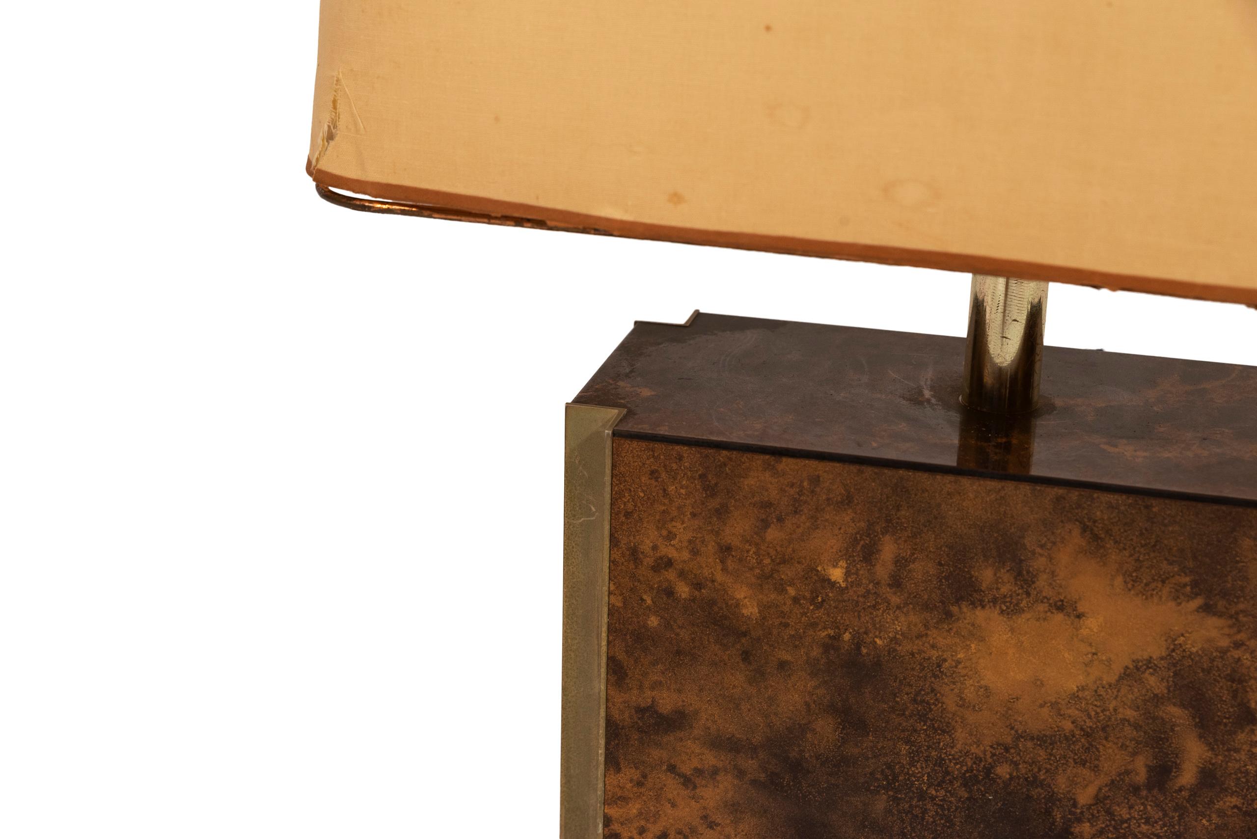 Guy Lefevre for Jansen,
pair of table lamps,
amber lacquer and gilded brass, circa 1970, France.
Measures: Height 59 cm, width 40 cm, depth 19 cm.