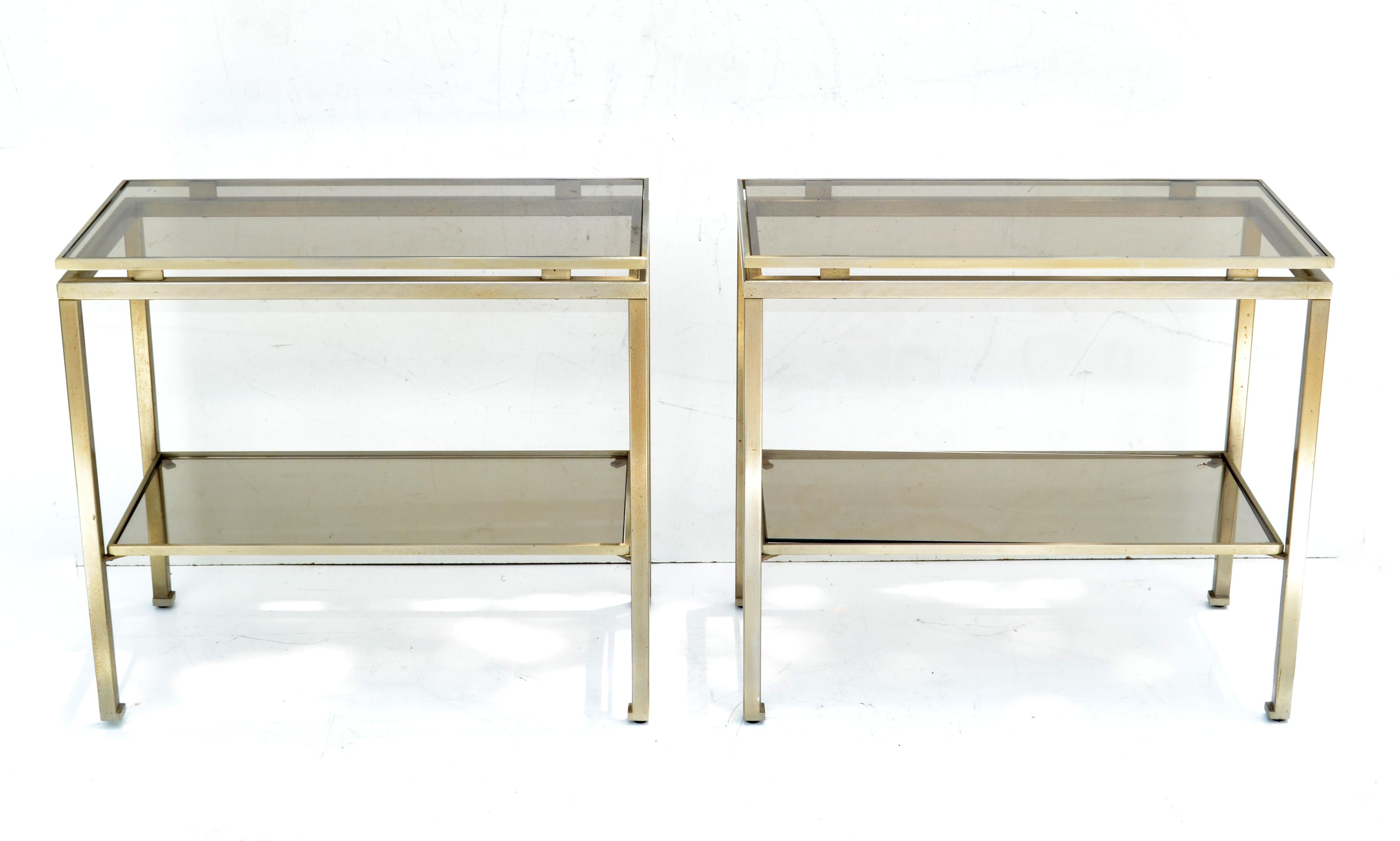 Pair of Guy Lefevre for Maison Jansen side table or end table with 2-tier floating glass tops.
Made out of nickel and smoked glass.
French Mid-Century Modern classic design in superb craftsmanship.
Space in between the 2-tiers measures 11.5