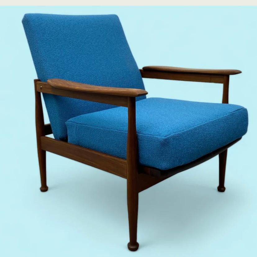 A stunning mid century 'manhattan' 'low backed' lounge chair designed by Guy Rodgers during the 1960s. The low backed lounge chair is in excellent condition. The teak frame, legs & arms have all been refurbished & the back & seat professionally