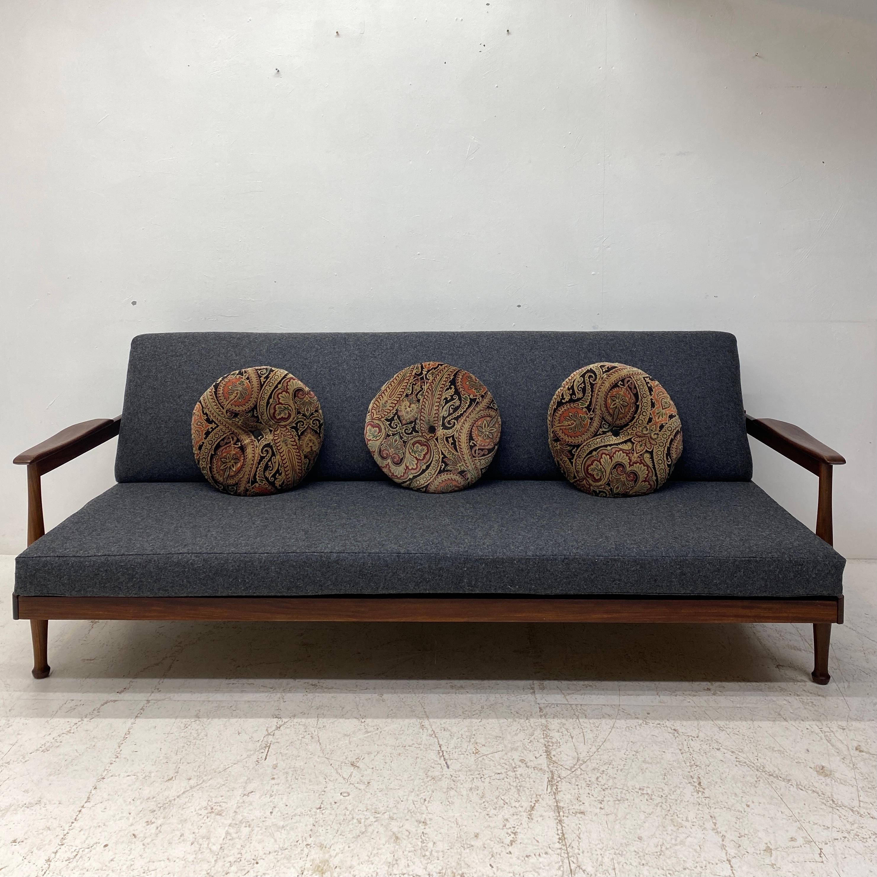 A beautifully restored midcentury sofa bed from Guy Rogers Manhattan range. The studio couch was designed in 1962 by George Fejer and Eric Phamphilan & made in Britain. This studio couch has been totally restored and reupholstered. The afromosia
