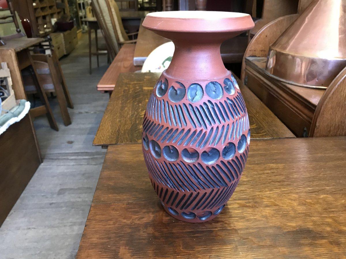 Guy Sydenham for Poole Pottery, A hand thrown clay terracotta studio vase.
Signed and stamped shape number to the base.

Guy Sydenham was a master potter for more than 50 years, renowned for the highly original work he created in the Poole Pottery