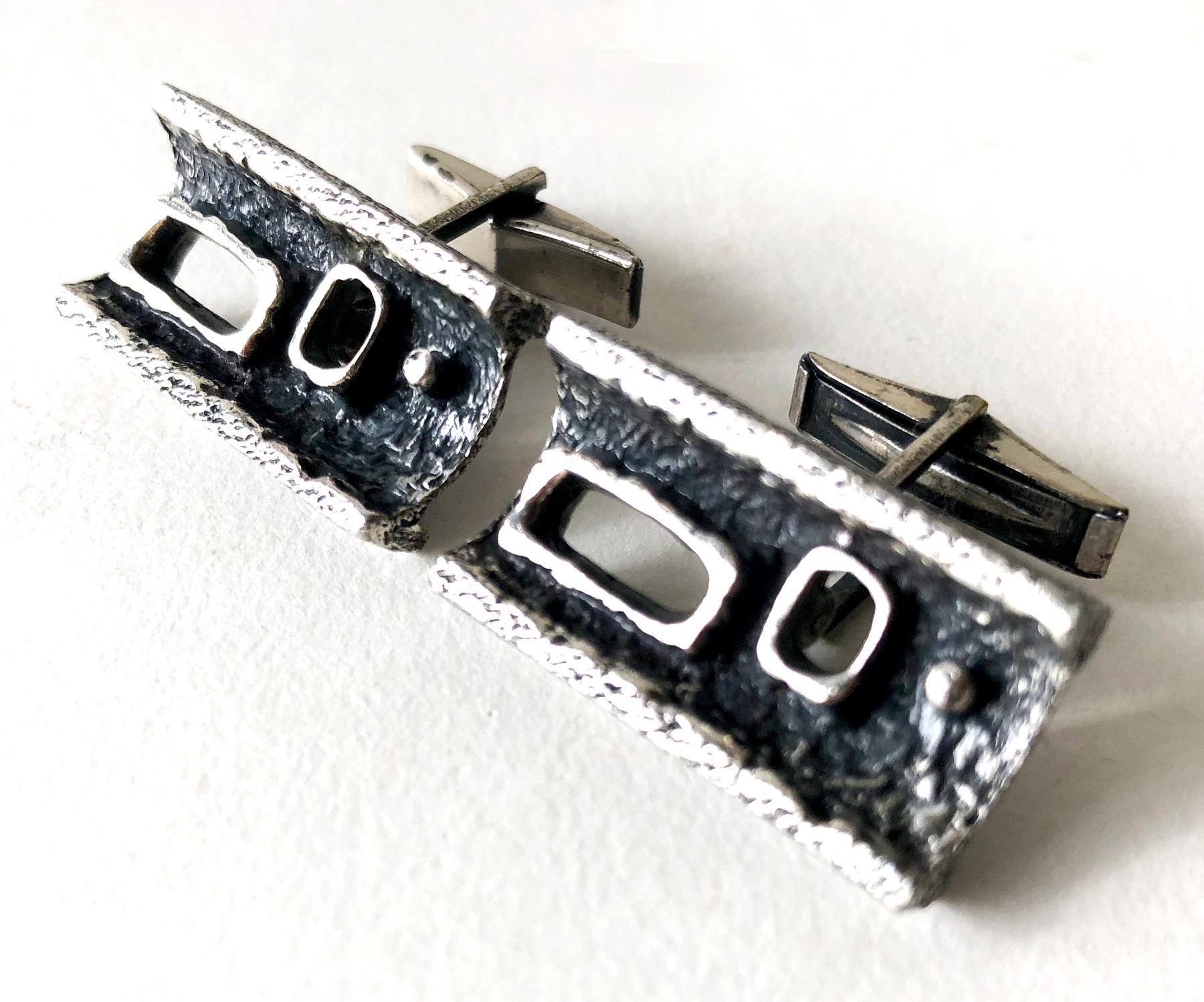 Brutalist cufflinks made by Canadian modernist jeweler Guy Vidal, circa 1970s.  Cufflinks are made of a pewter alloy, a mixture of pewter with other metals that was formulated by Vidal.  They measure 5/8