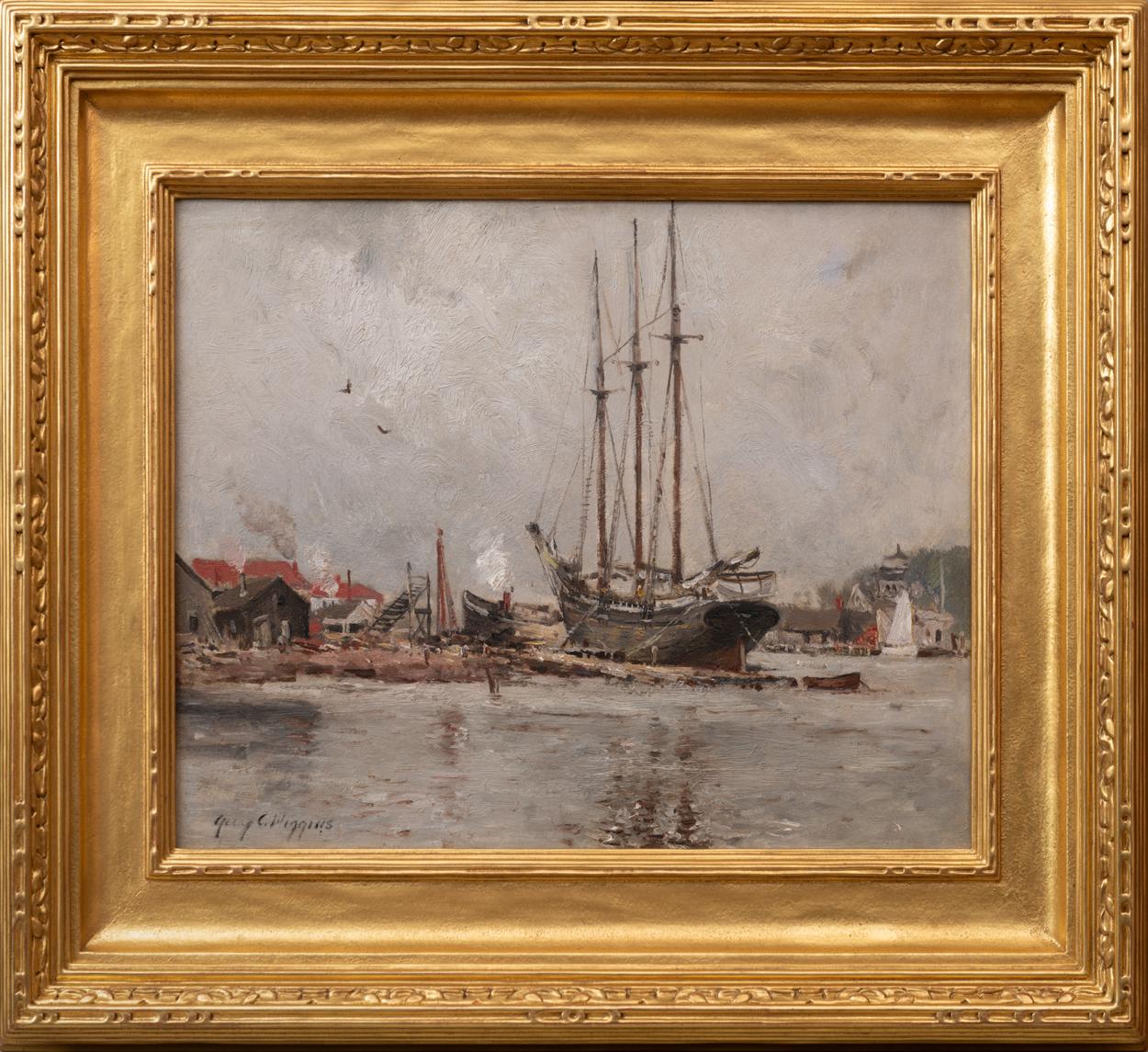 In his oil painting, “Gloucester,” Guy C. Wiggins paints a large sailing ship docked at the edge of harbor, its three masts reaching up towards a morose gray sky. 