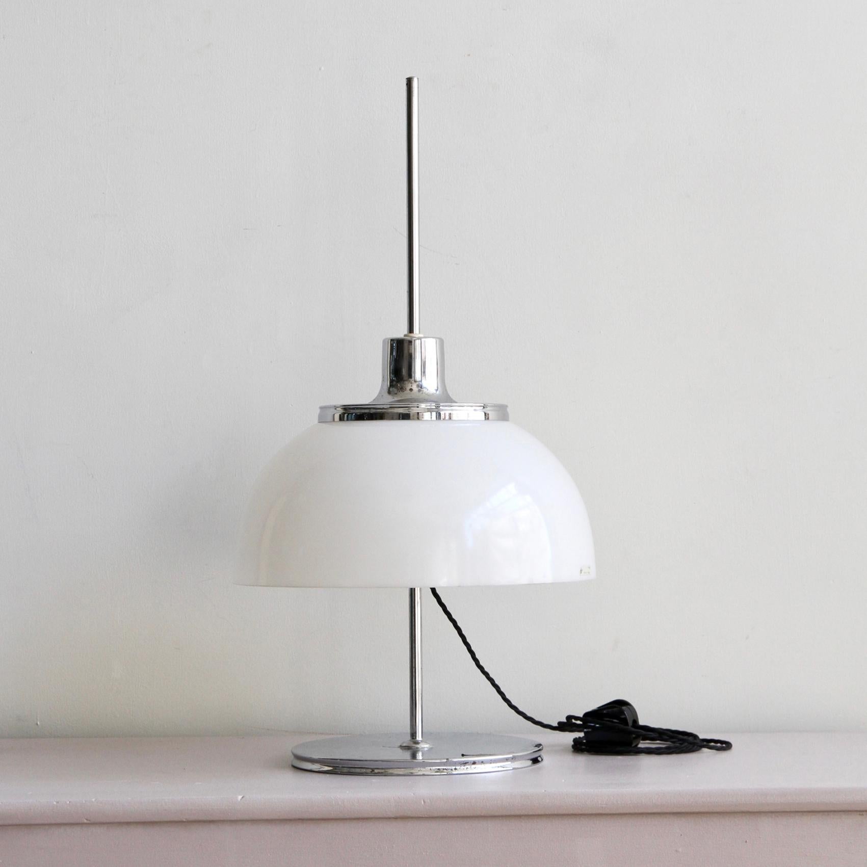 Harvey Guzzini chrome-plated mushroom lamp with a white acrylic shade, circa 1970s. With the original Guzzini sticker attached to the shade. The lamp has a chrome-plated top, centre column and base. There is some wear to the chrome which shows the