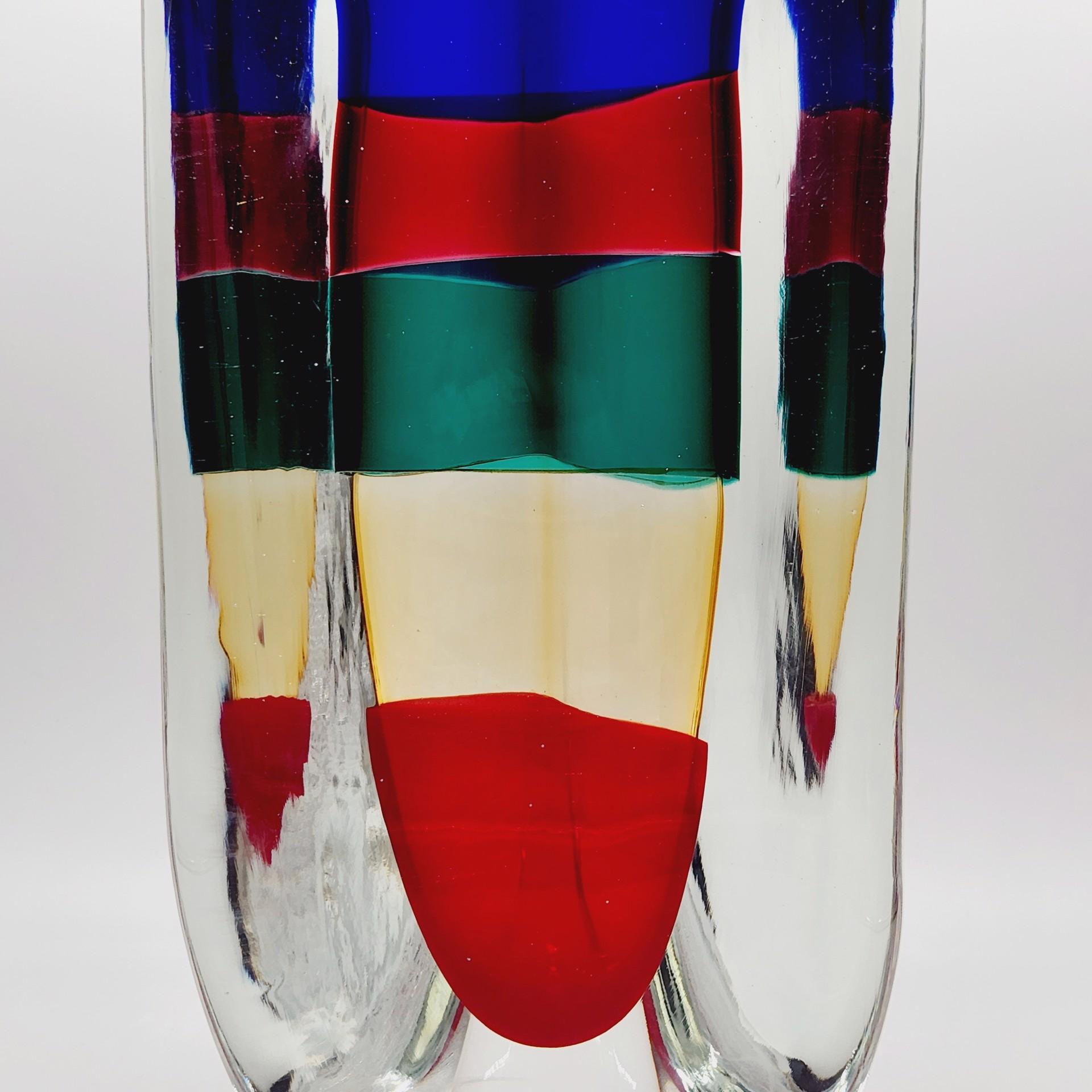 Thick, transparent glass with immersed stripes of red, yellow, blue and green, Fulvio Bianconi for Venini S.p.a., Murano 1991.
Signed, dated, original label and original box.
H. 12.75 x W. 6 x D. 6 in. - Weight: 24.6 lbs.
Like New Condition.
