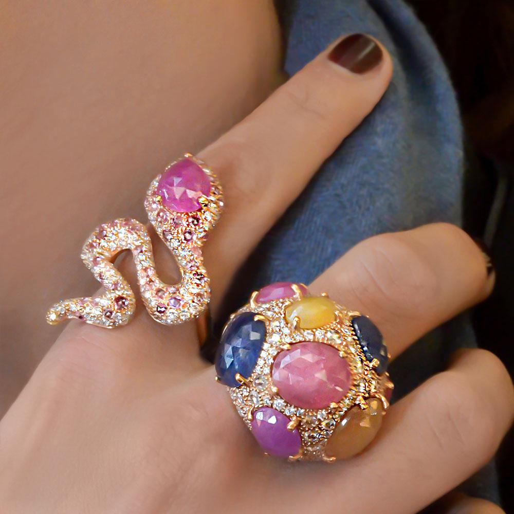 Made exclusively for Cellini Jewelers NYC,  by g.Verdi of Italy. This 18KT rose gold snake ring is entirely  pave set with rose cut pink sapphires and round brilliant cut white diamonds.  A pear shaped opaque pink sapphire is set as the serpents