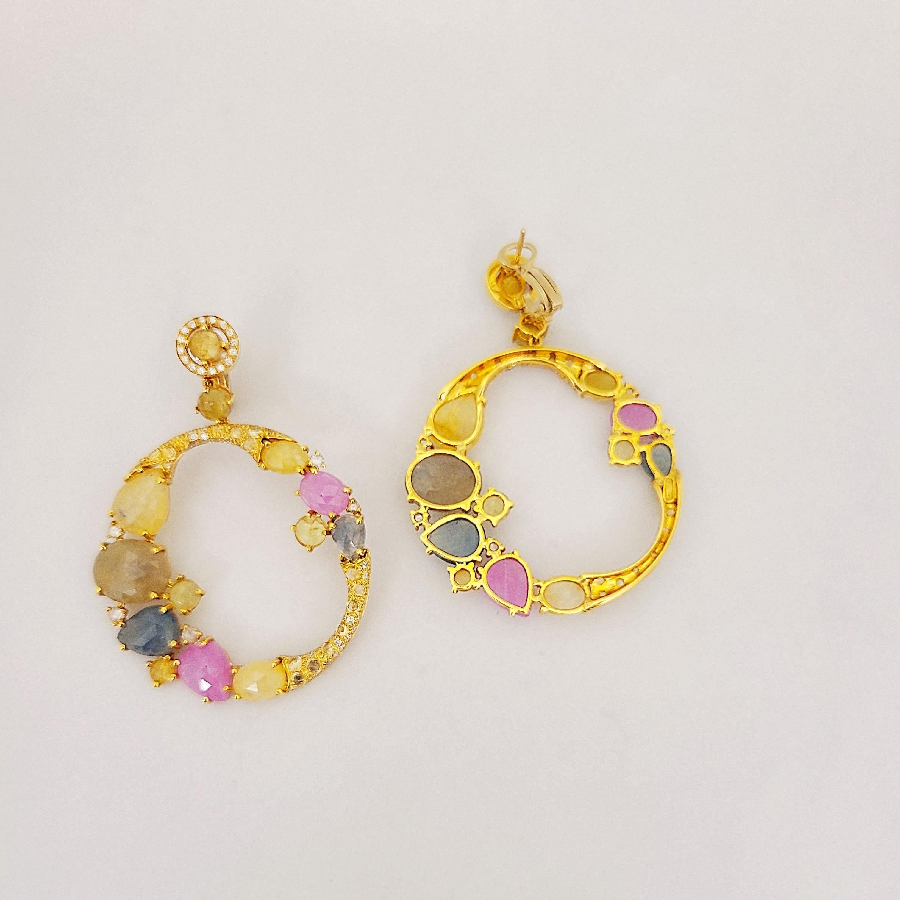 Designed and crafted by g. Verdi of Italy . These beautiful pendant hoop earrings feature multi colored pastel raw sapphires. The colors include yellow, pink, blue and green  Pear and oval shaped stones are set along with rose cut diamonds in these