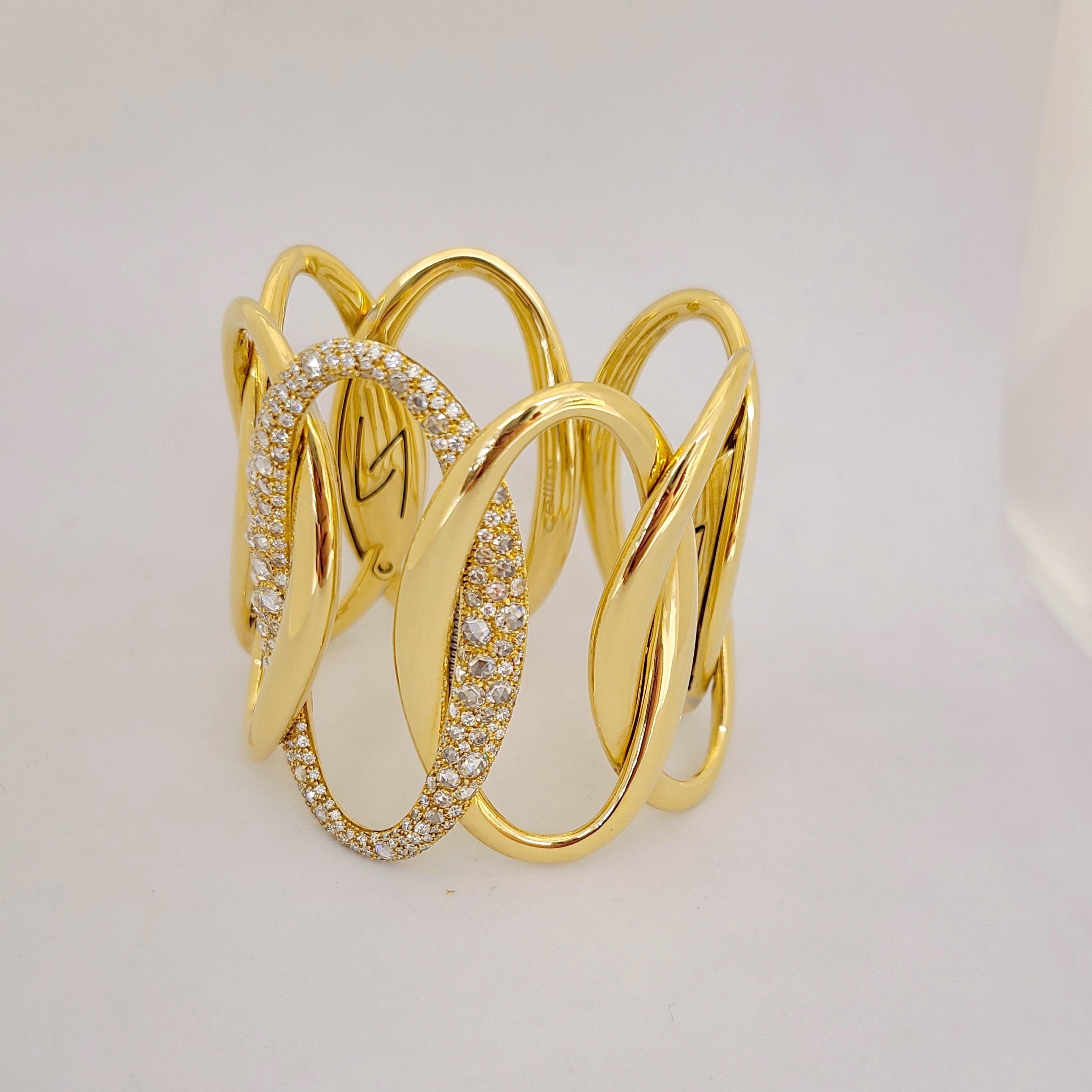Made exclusively for Cellini NYC by g. Verdi of Italy, this 18 karat yellow gold and diamond cuff bracelet is a real showstopper. Interlocking links in a hi-polished yellow gold finish with the center link set entirely with rose cut and brilliant