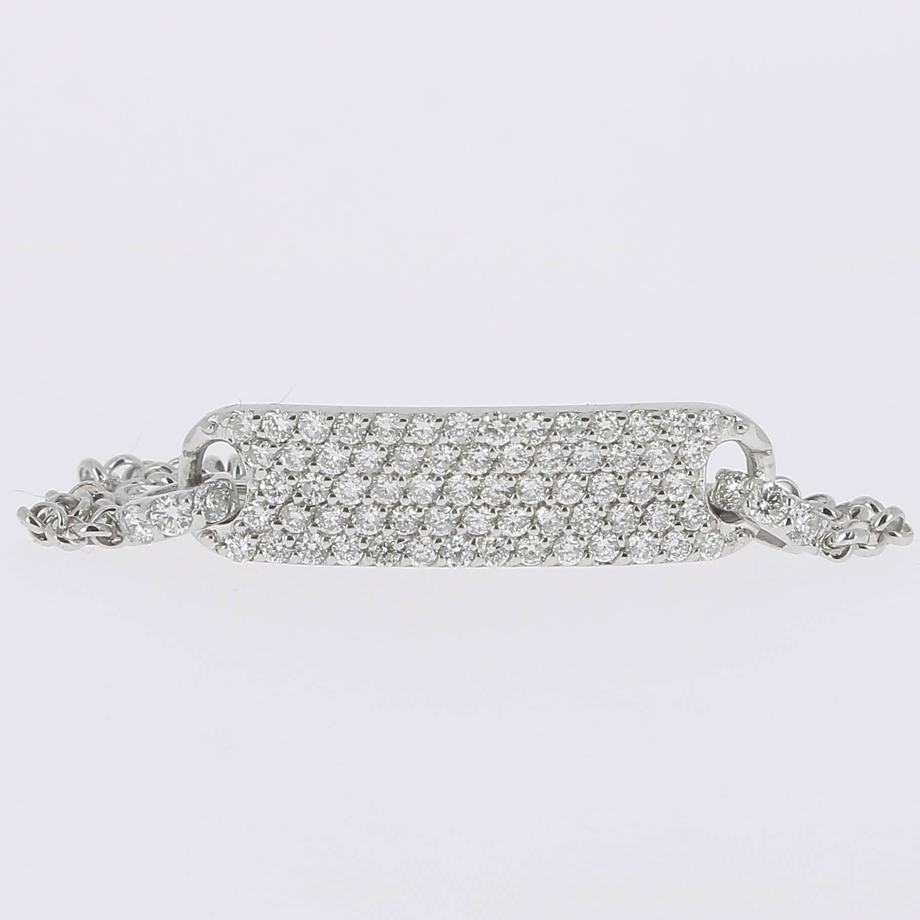 An amazing Tag Bracelet paved with diamonds weighing 0.60 carats, hanging on a chain bracelet.
Clasp with several links to adjust the size on the wrist.
The Diamonds are GVS qualities.
The Modern Bracelet weight 4.3 Grams (g).
The Bracelet is 18K
