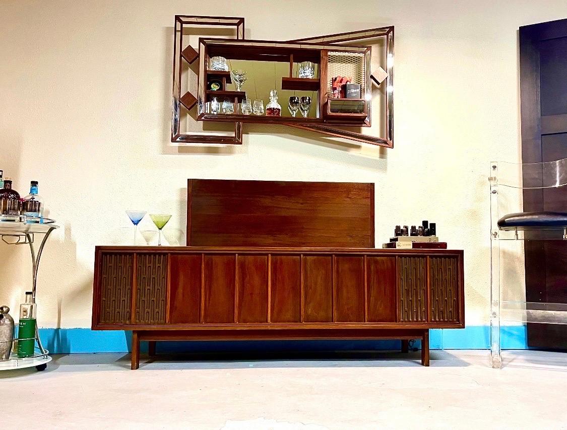 Thanks for looking at this refurbished, functioning midcentury stereo console.

This is an Americana low-boy cabinet. It shows great time period patina but refinished to a great looking piece. The new receiver works great, we have installed a new