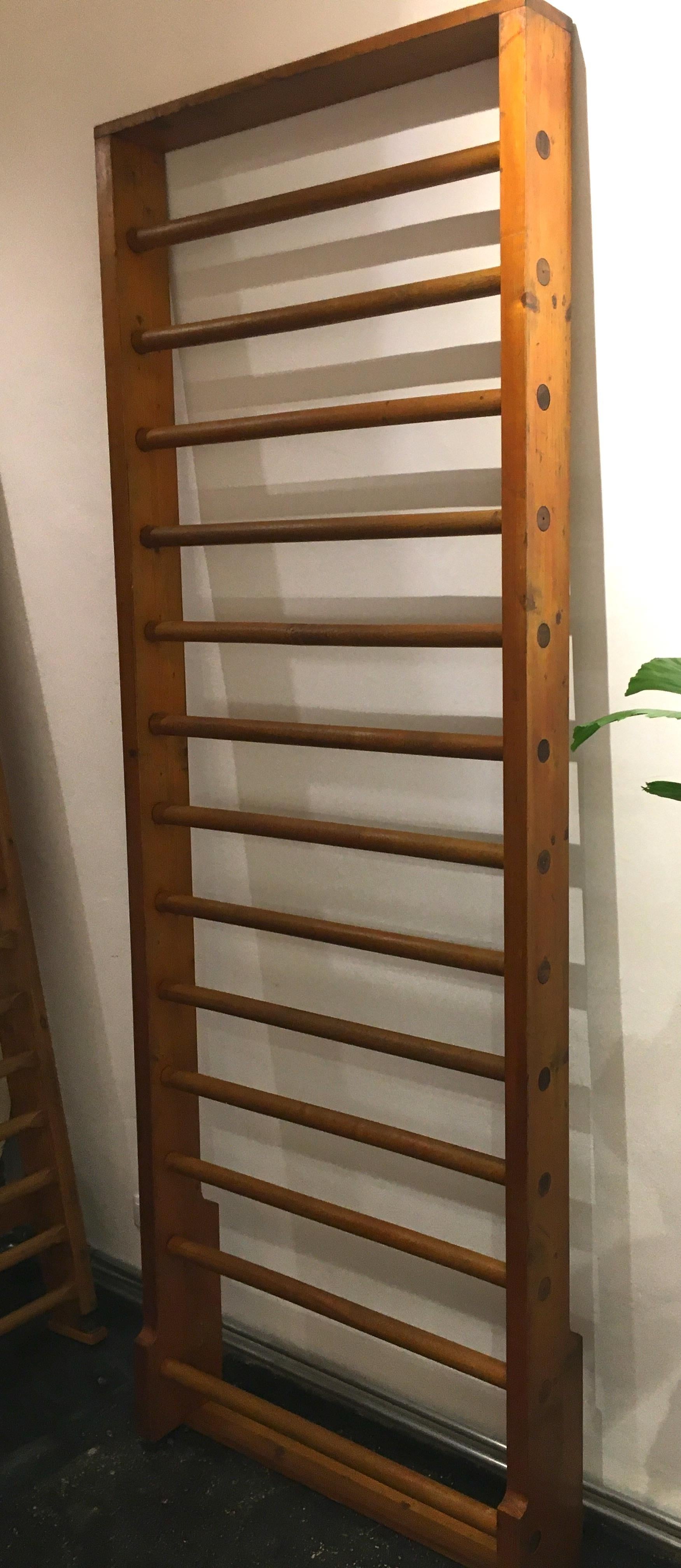 This wall bar from an old gym was completely restored, the wood shows a beautiful patina. Whether for a daily workout or as an object that also serves as a clothes rack or towel rack, this wall bars is definitely a real eyecatcher.