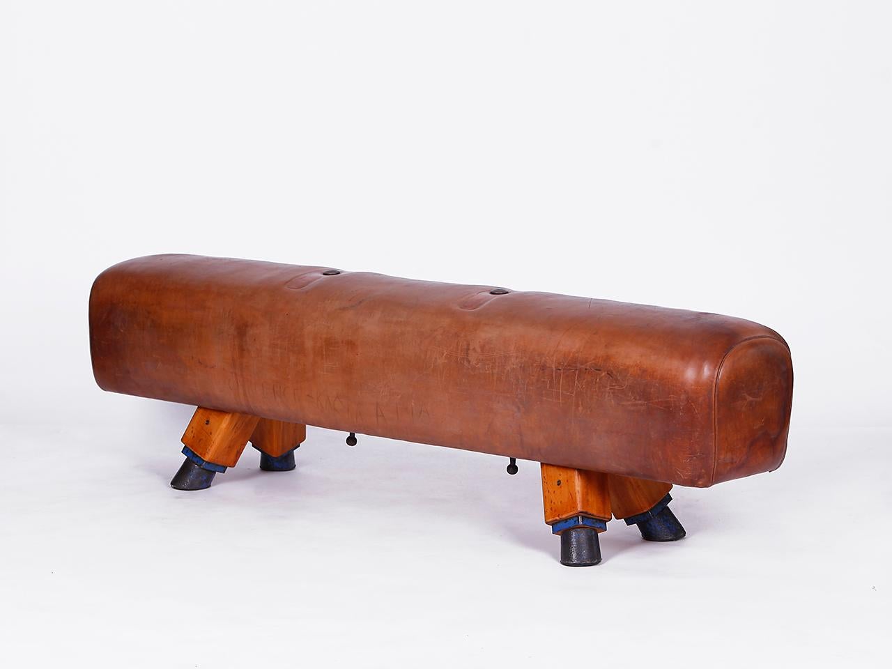 Pommel horse from former Czechoslovakia from the 1930s with beautiful patina, shortened to bench height 50cm and very good vintage condition. Completely restored. The iron feet are preserved. The thick leather has been cleaned and preserved. All of