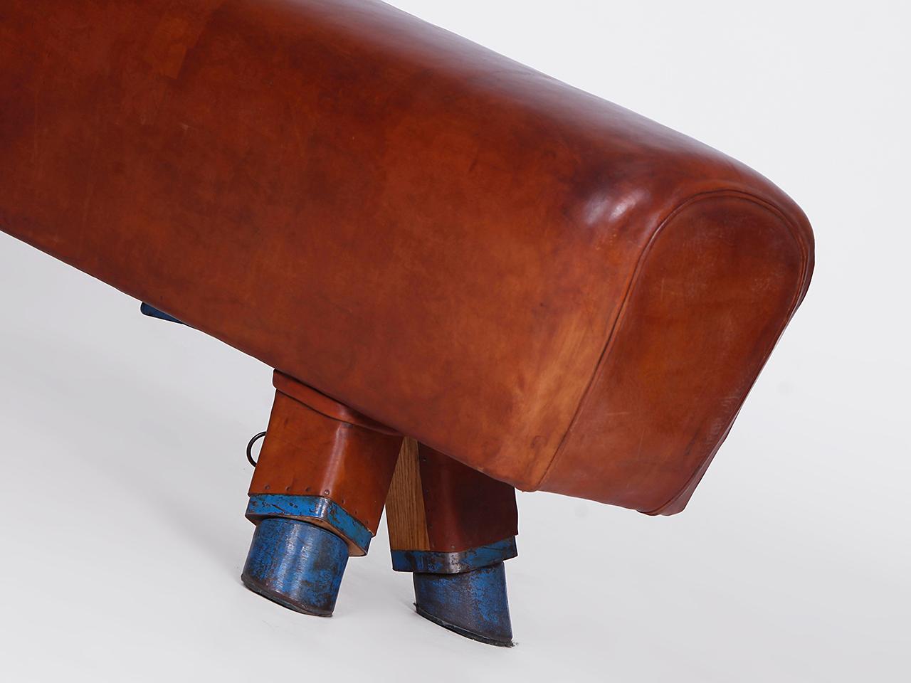 Pommel horse from former Czechoslovakia from the 1930s with beautiful patina, shortened to bench height 51cm and very good vintage condition. Completely restored. The iron feet are preserved. The thick leather has been cleaned and preserved. All of