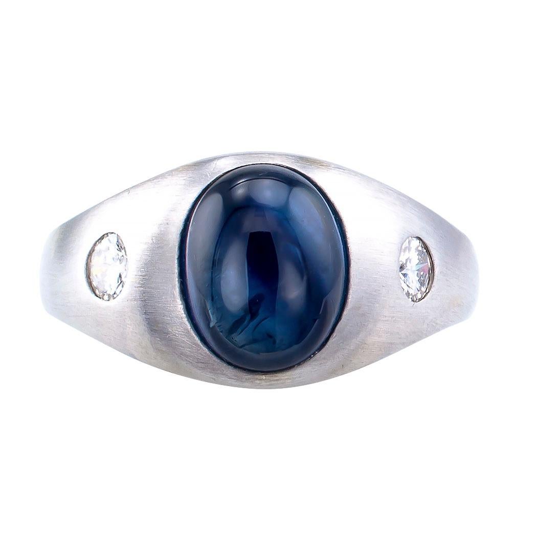 Cabochon sapphire and diamond gentleman’s three-stone white gold ring circa 1950.

DETAILS:
GEMSTONES:  one central, oval, cabochon blue sapphire weighing approximately 4.00 carats.

DIAMONDS:  two round brilliant-cut diamonds totaling approximately