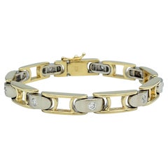 Zweifarbiges Gliederarmband aus poliertem 14 Karat Gold mit runden Diamanten in Gypsy-Fassung