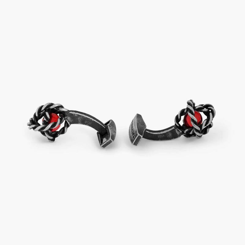 Gyroscope Glass Cufflinks in Antique Silver and Red Glass

These unique and delicate cufflinks have been formed from the hand-crafted rope effect rings interlocking each other to create a gyroscope effect. A single glass coloured bead has been