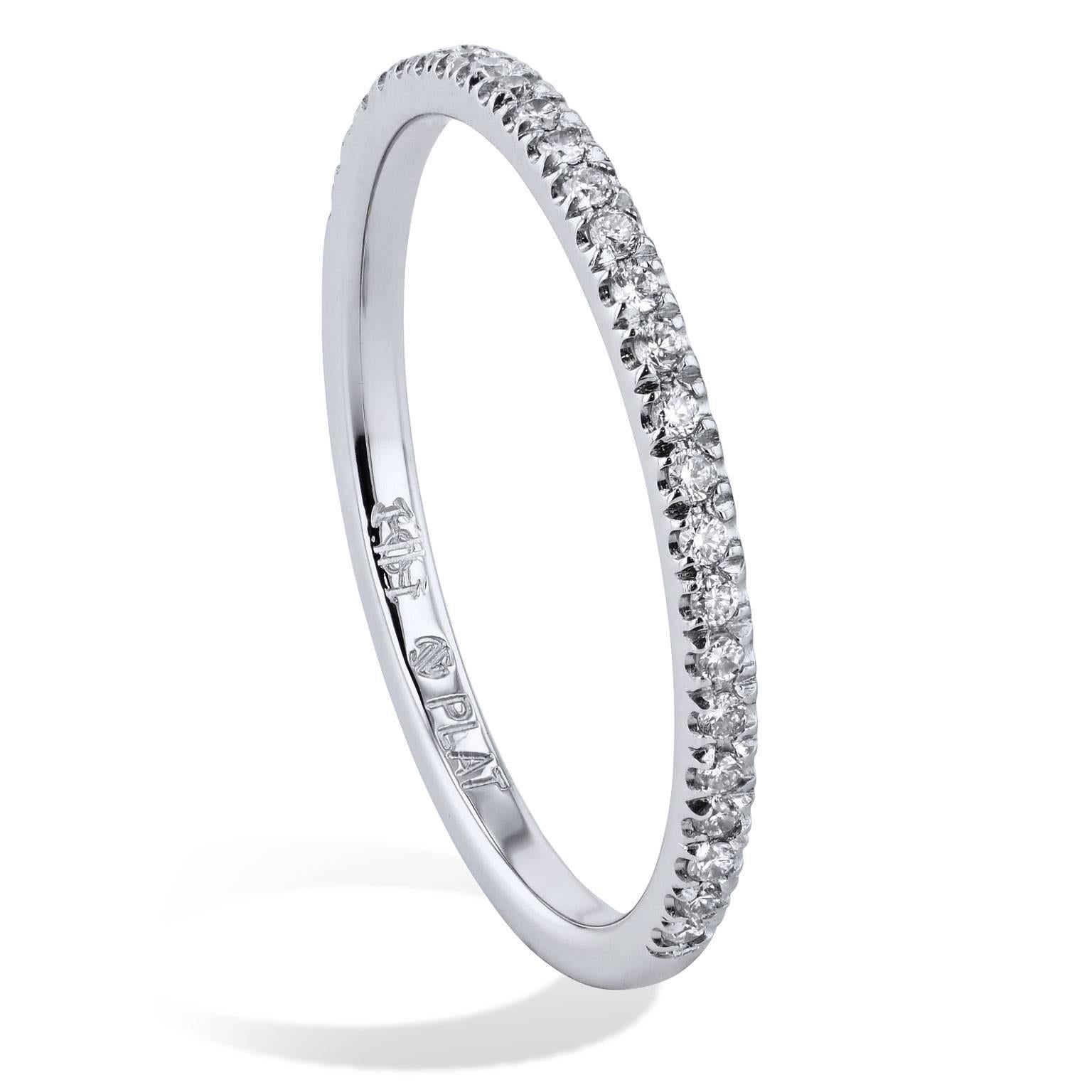 Imagine twenty-seven pave-set round brilliant cut diamonds encircling your finger in this handmade platinum band ring. This charming half-diamond band features a total weight of 0.13 carat with milgrain work on a 1.50 millimeter thick band