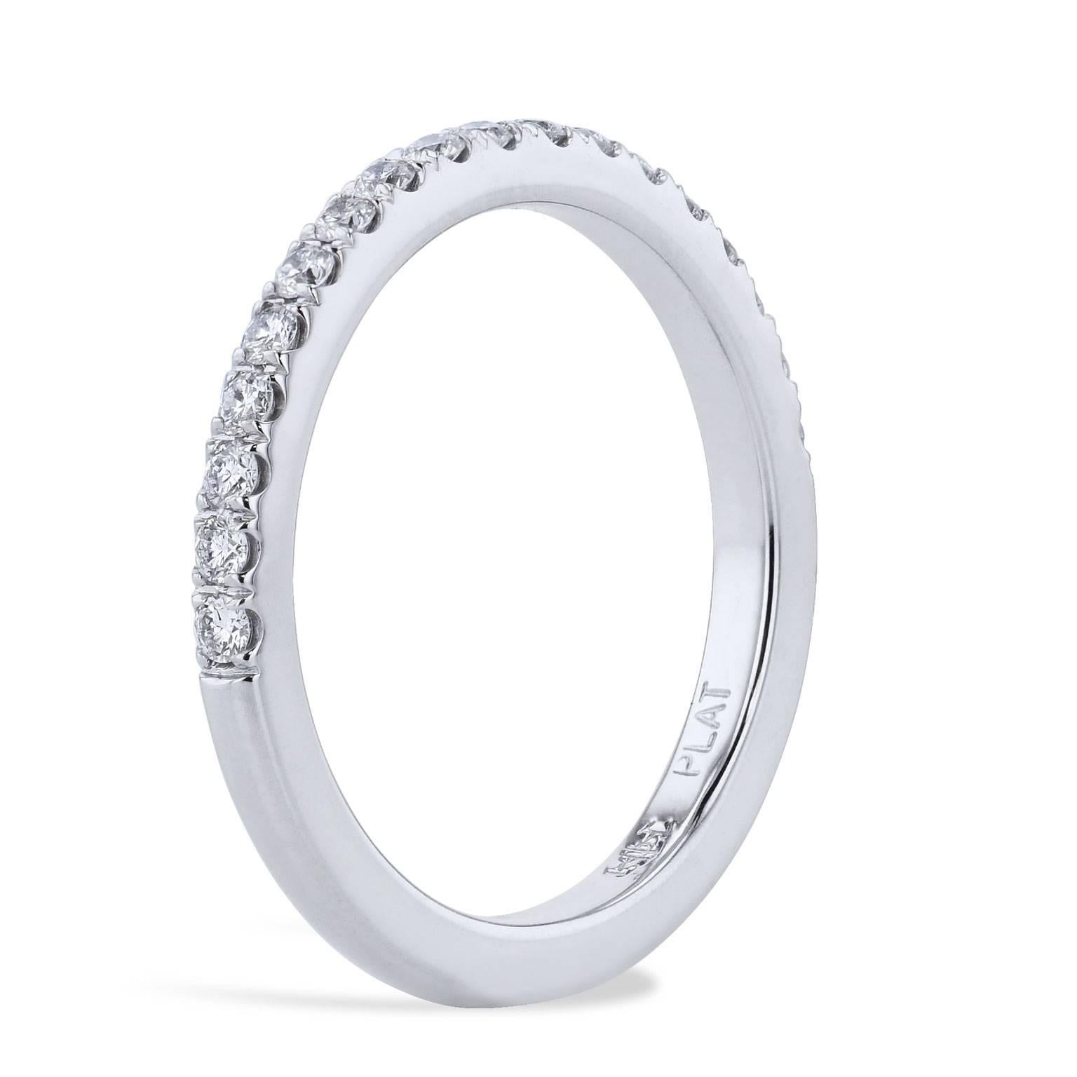Eighteen pave-set diamond with a total weight of 0.25 carat (F/G/VS) are affixed to a platinum band that is 2.00 millimeter thick. This handmade band ring is as lovely as she.