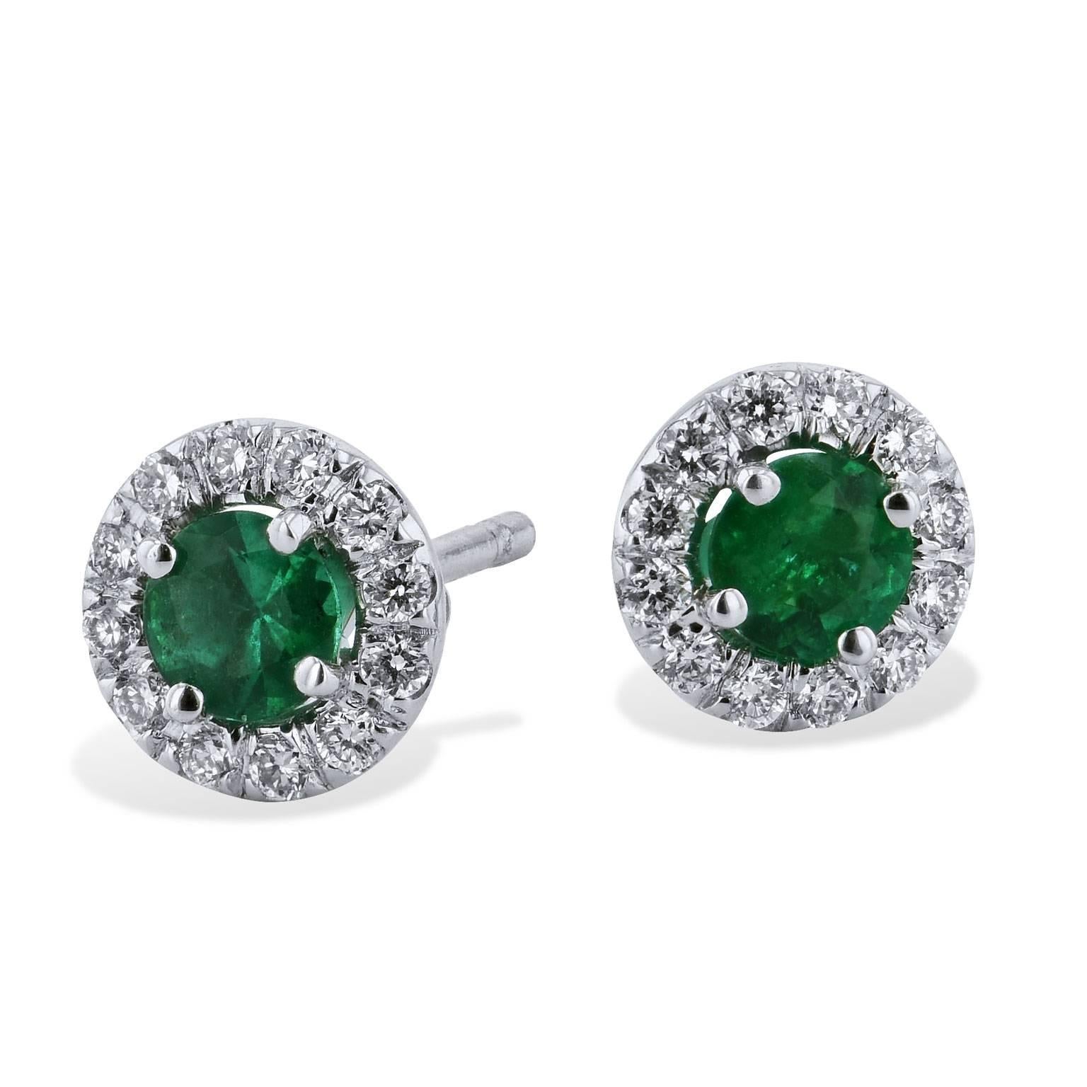 A sea of emerald green stirs with enchantment in these handmade 18 karat white gold 0.34 carat emerald stud earrings featuring 0.18 carat of pave-set diamond (G/H/VS/SI1).