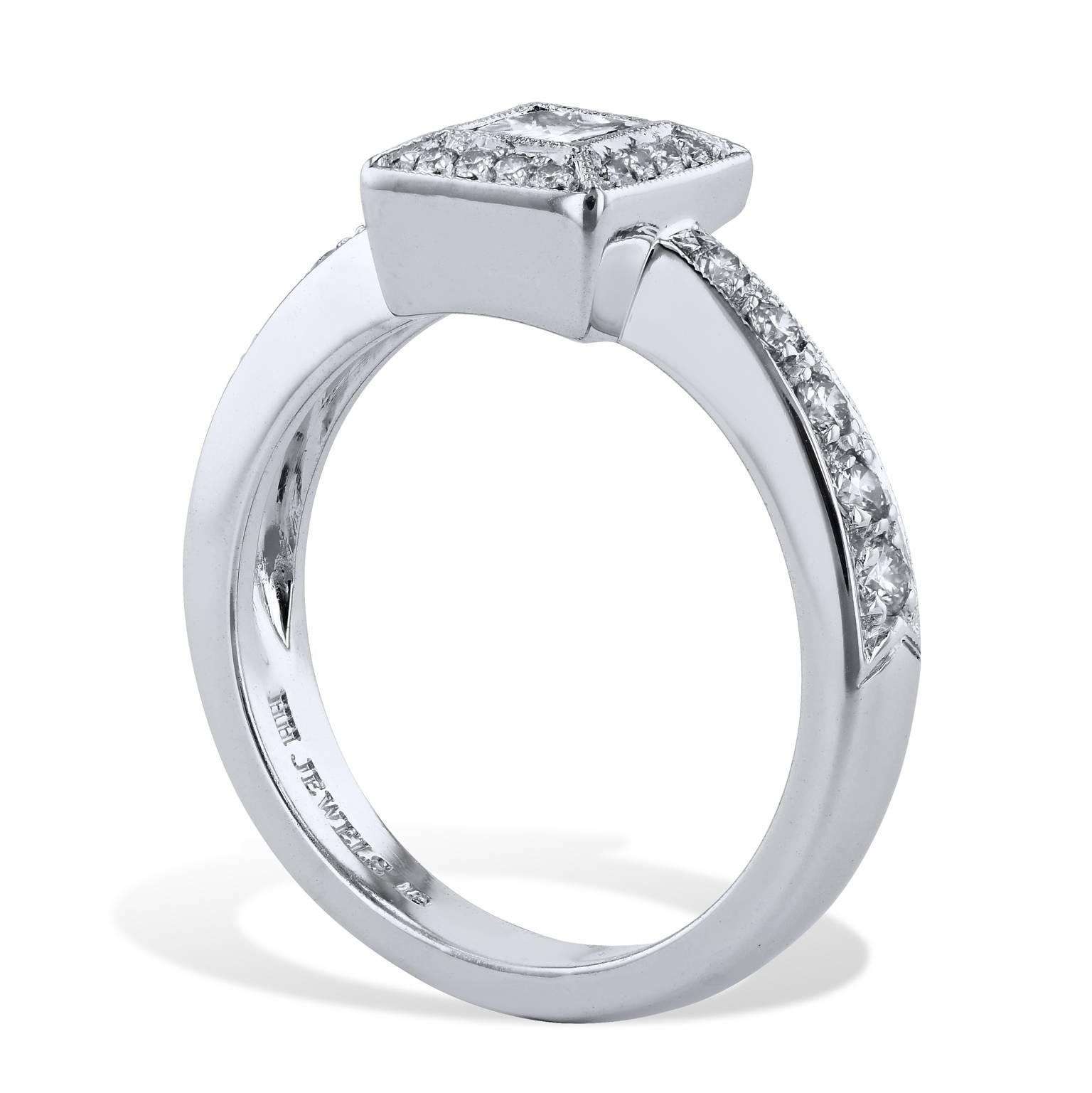 This 0.35 carat princess cut diamond (H/VS) surprises and excites with transcendent elegance in this handmade 18 karat palladium engagement ring. 0.23 carat of pave set diamonds (H/VS) adorn the bezel and cascade down the shank; further highlighting