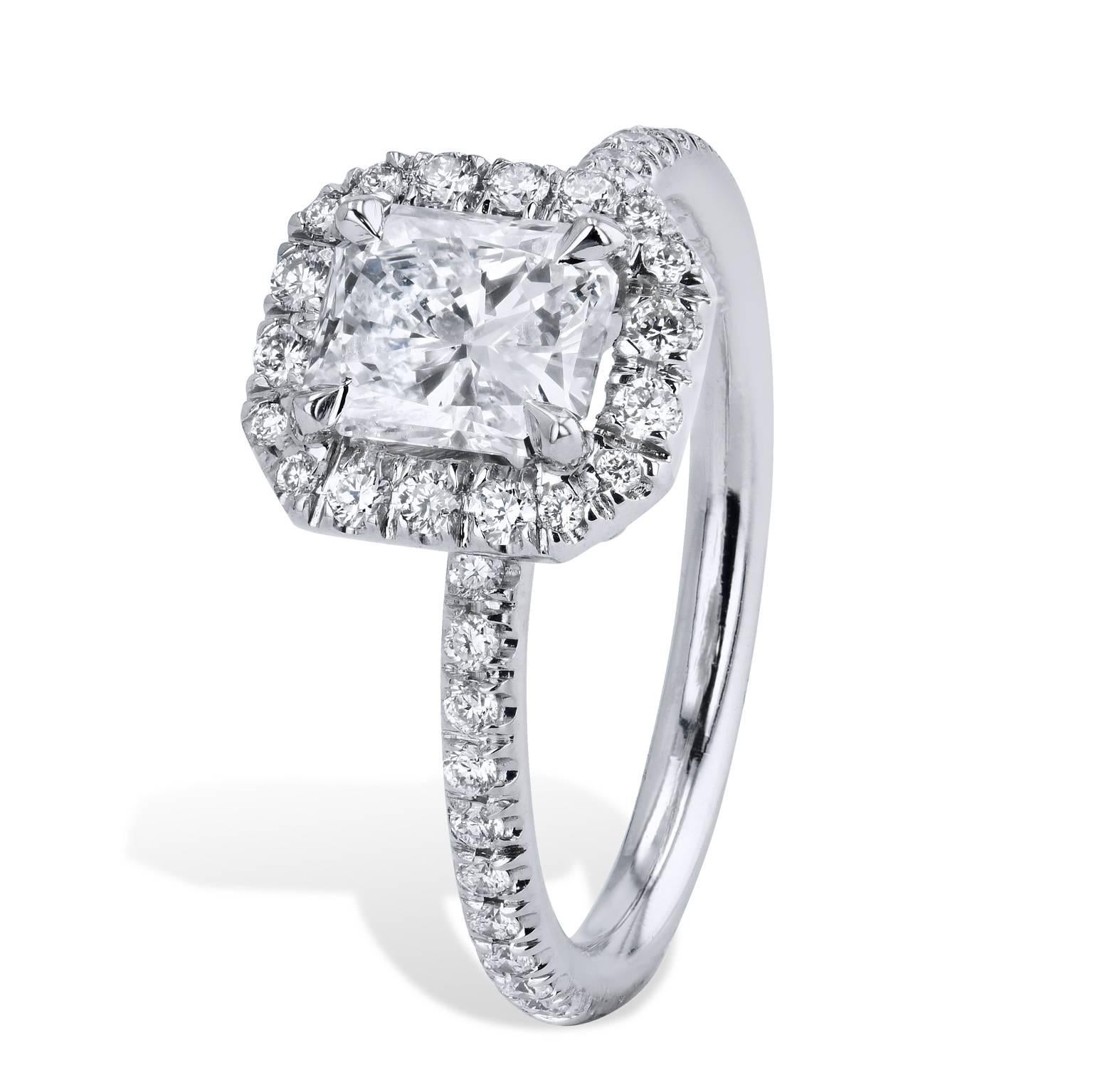 A platinum engagement ring that peers right into one's soul. A 1.05 carat emerald cut diamond prong-set at center (E/I1; GIA# 5181930855) focuses one's gaze, while 0.31 carat of pave set diamond (D/E/F/VS), out pour from center and form a halo.