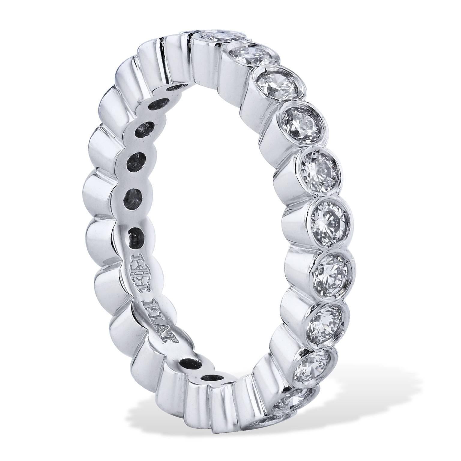 This handcrafted platinum eternity band ring features bezel-set round diamonds with a total weight of 1.11 carat (E/F/VS). Each diamond is bezel set and placed together to produce an eternity band ring that stirs and illuminates the essence of her