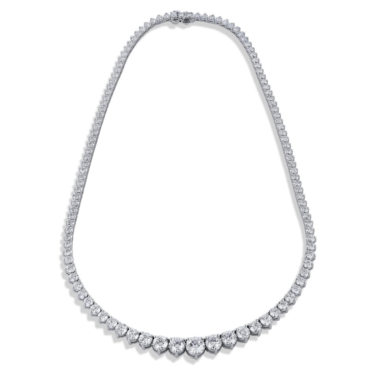 Drop into a scene of elegance with this three-prong set graduated row of round brilliant-cut diamonds that sparkle as they grow in size toward the center 1.14 carat diamond (F/WS1) in this handmade Riviera necklace. Fashioned in 18 karat white gold,