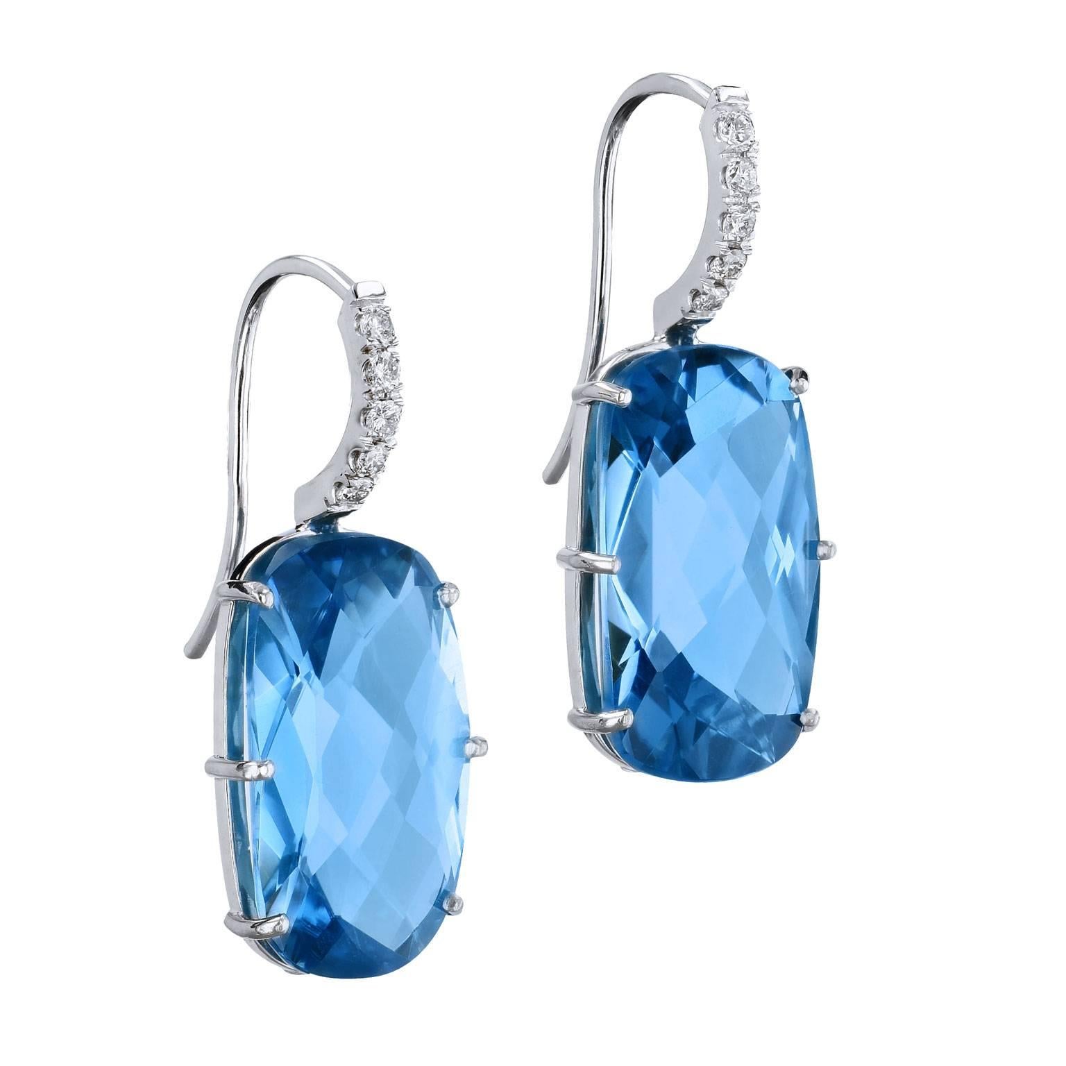 20.34 Carat Blue Topaz with Diamond Pave Earrings in 18 Karat White Gold 

These beautiful earrings are one of a kind and handmade by H&H Jewels.  They are fashioned in 18 karat white gold, with 20.34 carat of oval-shaped topaz that are prong-set