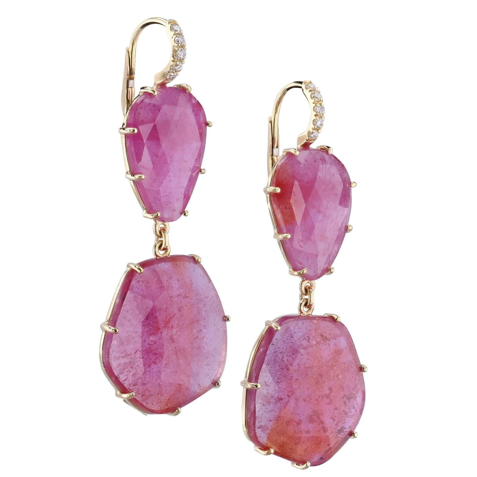 An original H and H design, these handcrafted 18 karat yellow gold dangle earrings feature 42.40 carat of reddish/pink sapphire slices. Slices provide an interesting presentation that allow the sapphire's natural beauty to be highlighted. Oblong and