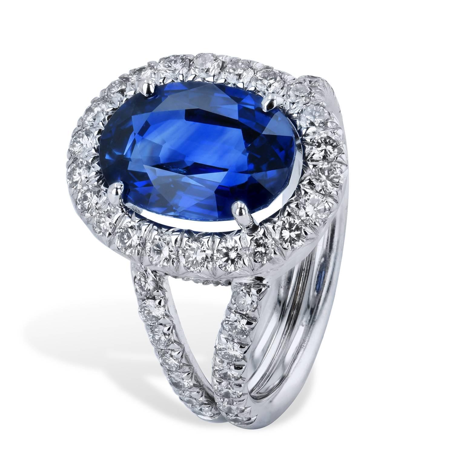 Elegance coupled with impeccable design, this handmade blue sapphire and diamond ring is a piece for the regal woman full of poise and grace. Featuring a 4.37 carat blue heated sapphire at center (GIA# 1106515154) while 1.04 carat of round brilliant