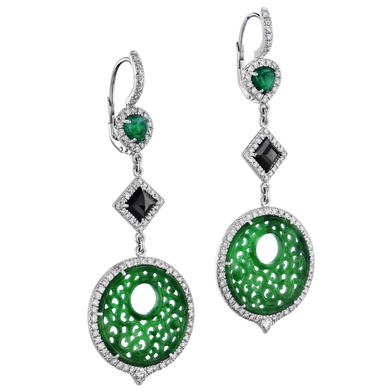 These are one of a kind, handmade earrings by H&H Jewels. They consist of 19 millimeters of fine jadeite that feature exceptional embellishment. They also have 1.48 carats of square black diamonds and 1.19 carats of oval emerald cabochons that trail