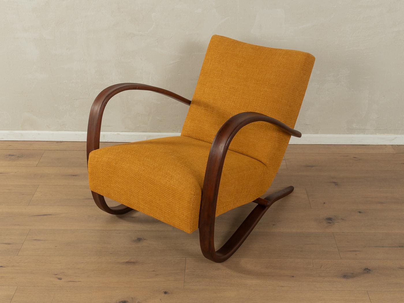 Exclusive Art Deco H-269 armchair by Jindrich Halabala from the 1930s with filigree frame made of curved ash wood. The chair has been reupholstered and covered with a high-quality fabric in saffron yellow.

Quality Features:
accomplished design: