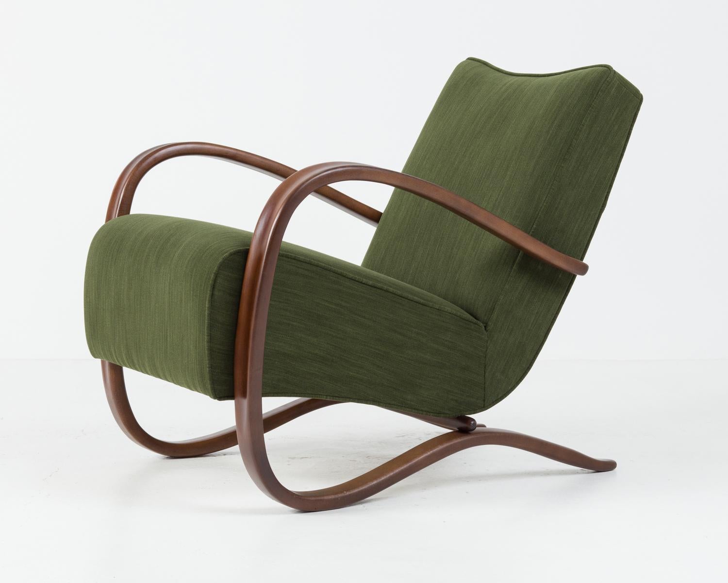The legendary Halabala H-269 chair designed by Jindřich Halabala circa 1930. One of the most well known czechoslovakian designs in the world. 
Bent beechwood frame restored to high gloss. Seating recreated and covered in high quality italian fabric.