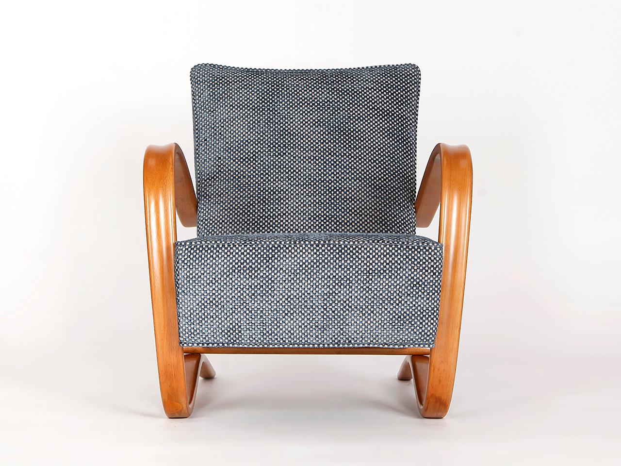 This lounge chair by Jindrich Halabala for Spojene UP Zavody was produced during the 1930s. The piece has been completely restored with a new spring. Covered in a velvet fabric from English company Colefax and Fowler.