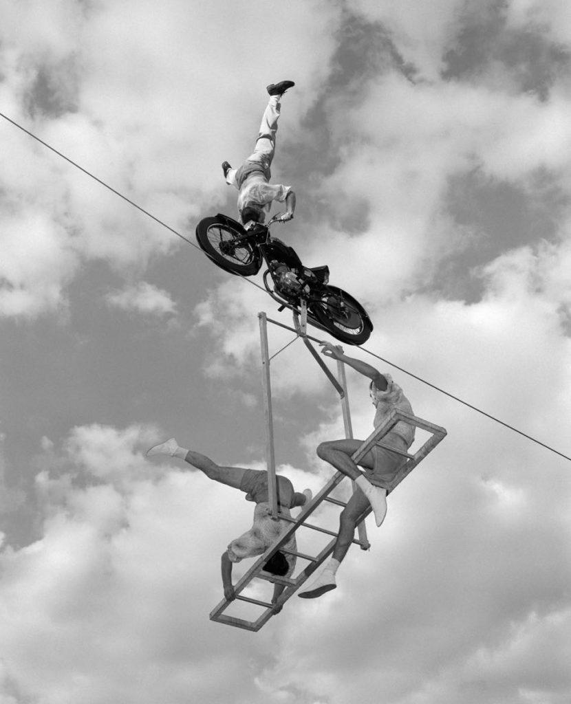 H. Armstrong Roberts Figurative Photograph - High Wire Motorcycle (1960) Silver Gelatin Fibre Print - Oversized 