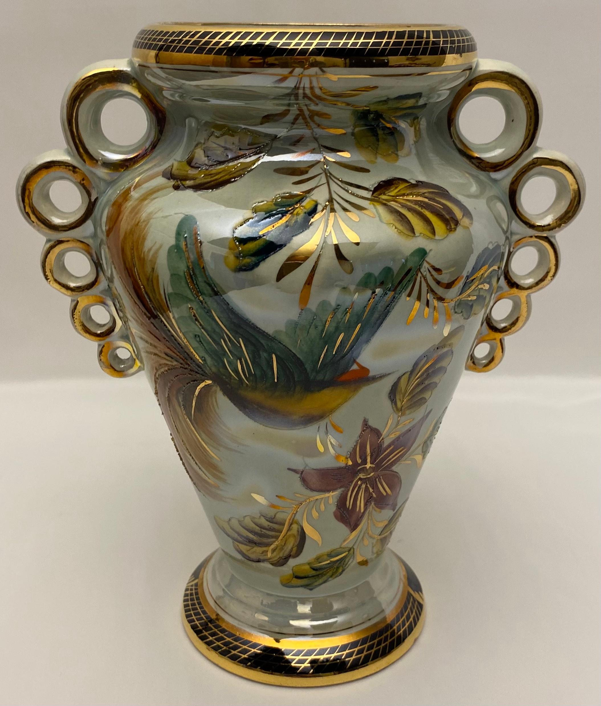 A celadon colored porcelain floral motif vase, by H. Bequet Quaregnon, Belgium, c. 1940. This decorative vase would look great displayed in an array of interior styes. 

The celadon and gold trimmed vase is heavily decorated throughout with a