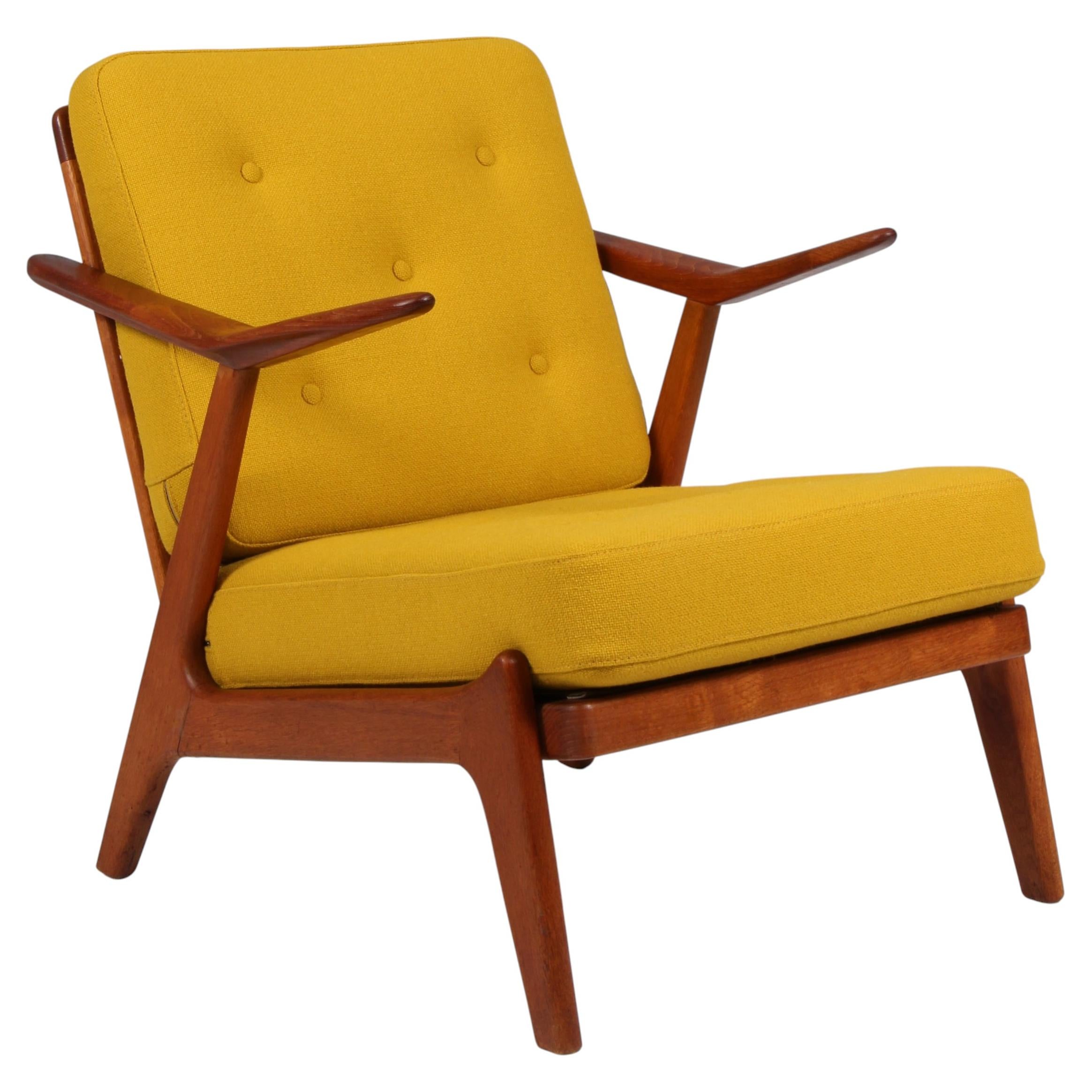 H. Brockman Petersen lounge chair of teak and oak. Yellow Hallingdal wool