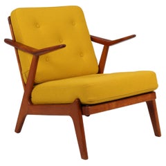 H. Brockman Petersen lounge chair of teak and oak. Yellow Hallingdal wool