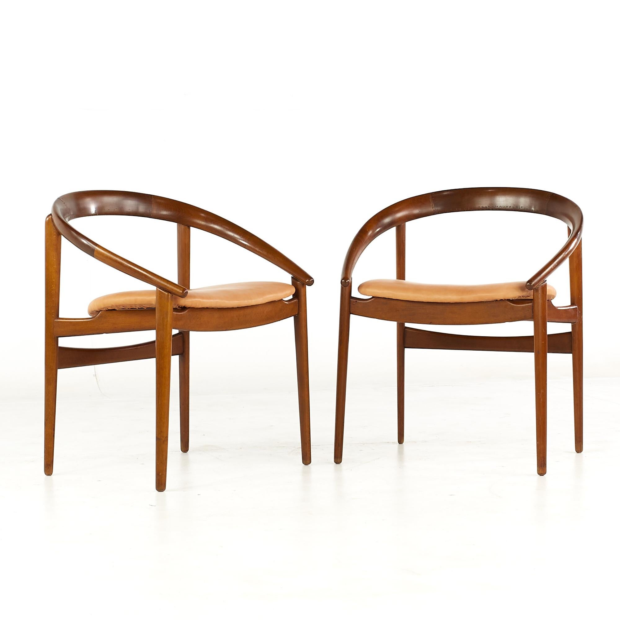 H Brockmann Petersen for Louis G Thiersen mid century Teak Horseshoe Chairs - Pair.

Each chair measures: 23 wide x 18 deep x 27 high, with a seat height of 18 and arm height/chair clearance 22 inches.

All pieces of furniture can be had in what
