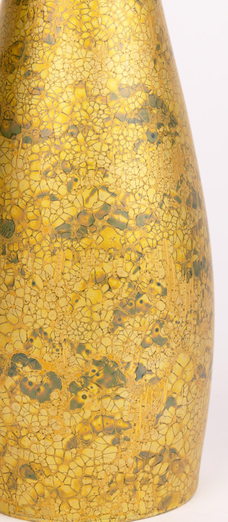 A stylish vintage German Rosenthal Studio-Linie hand made porcelain bottle shaped vase decorated in a gold fleck design by H Dressler and dating from around 1972. The finely made vase stands on a round unglazed foot rim with recessed base with a