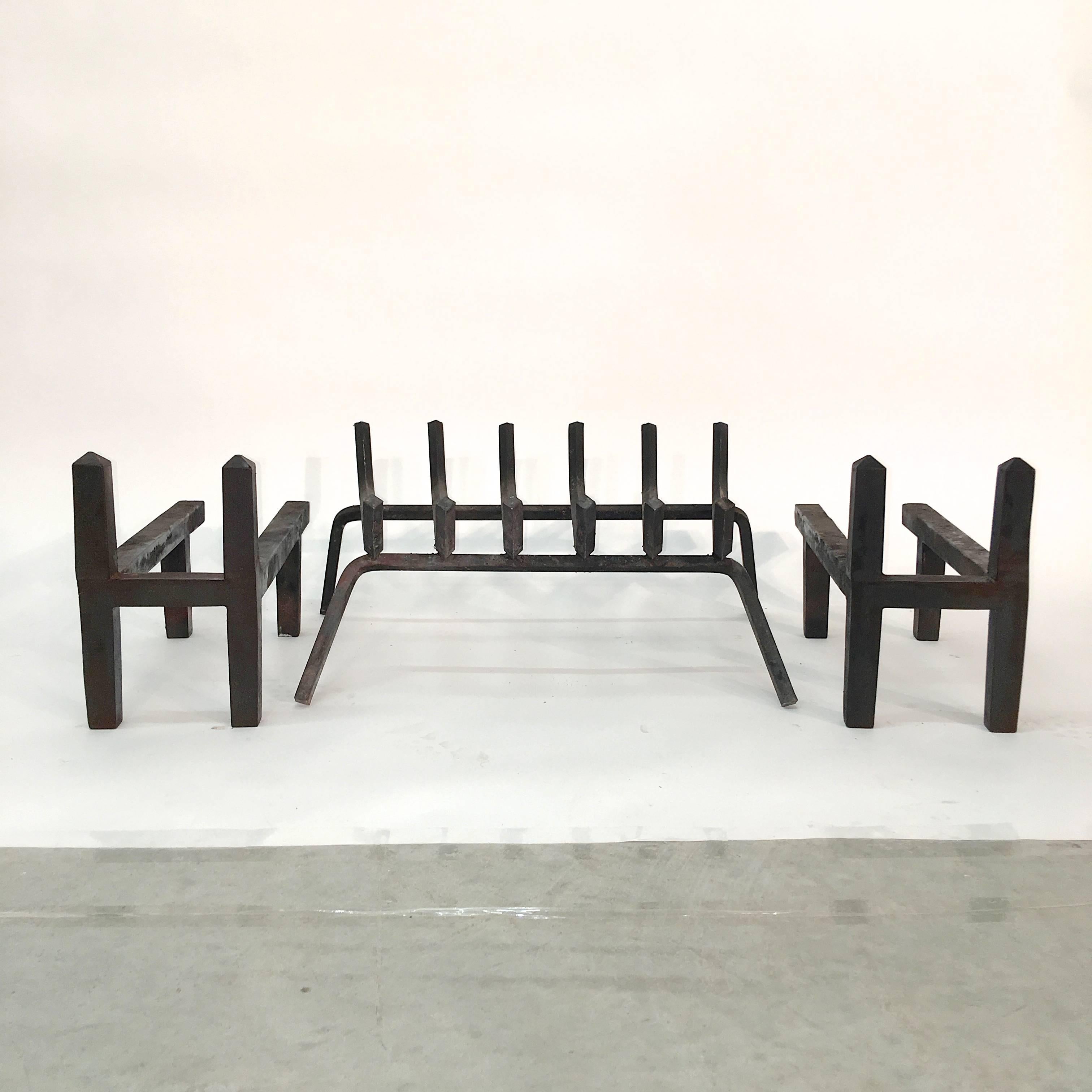 This is an original set of cast iron H-form andirons or chenets labelled Wm. H. Jackson Co. together with the original cast iron fire log basket. Late 1940s-early 1950s minimalist modern design. This company has been srafting some of the most