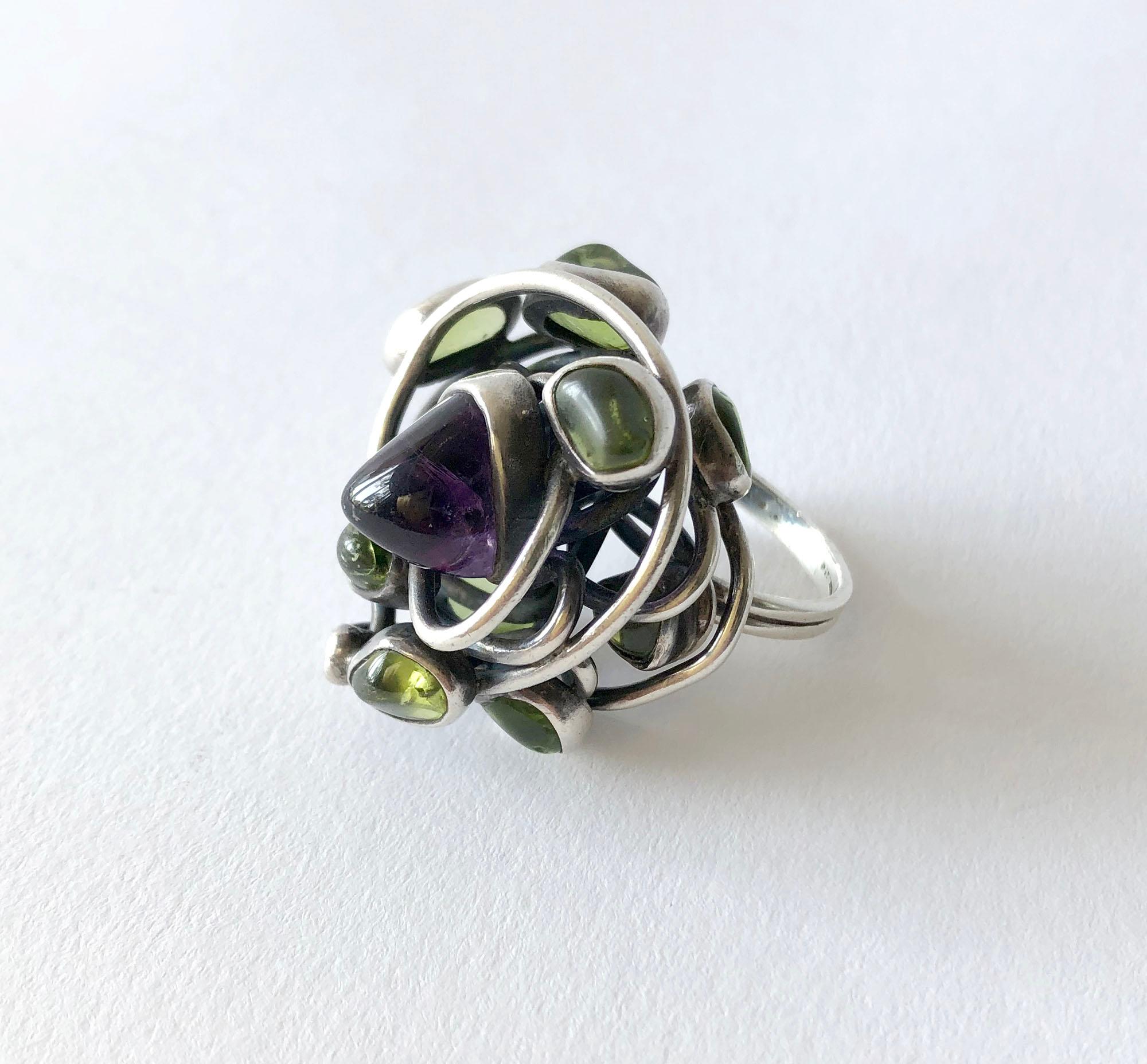 Nest of heavy gauge sterling silver wire ring set with natural tumbled amethyst and peridot created by H. Fred Skaggs of Scottsdale, Arizona. Ring is a finger size 8 while its top, nest portion measures 1.25