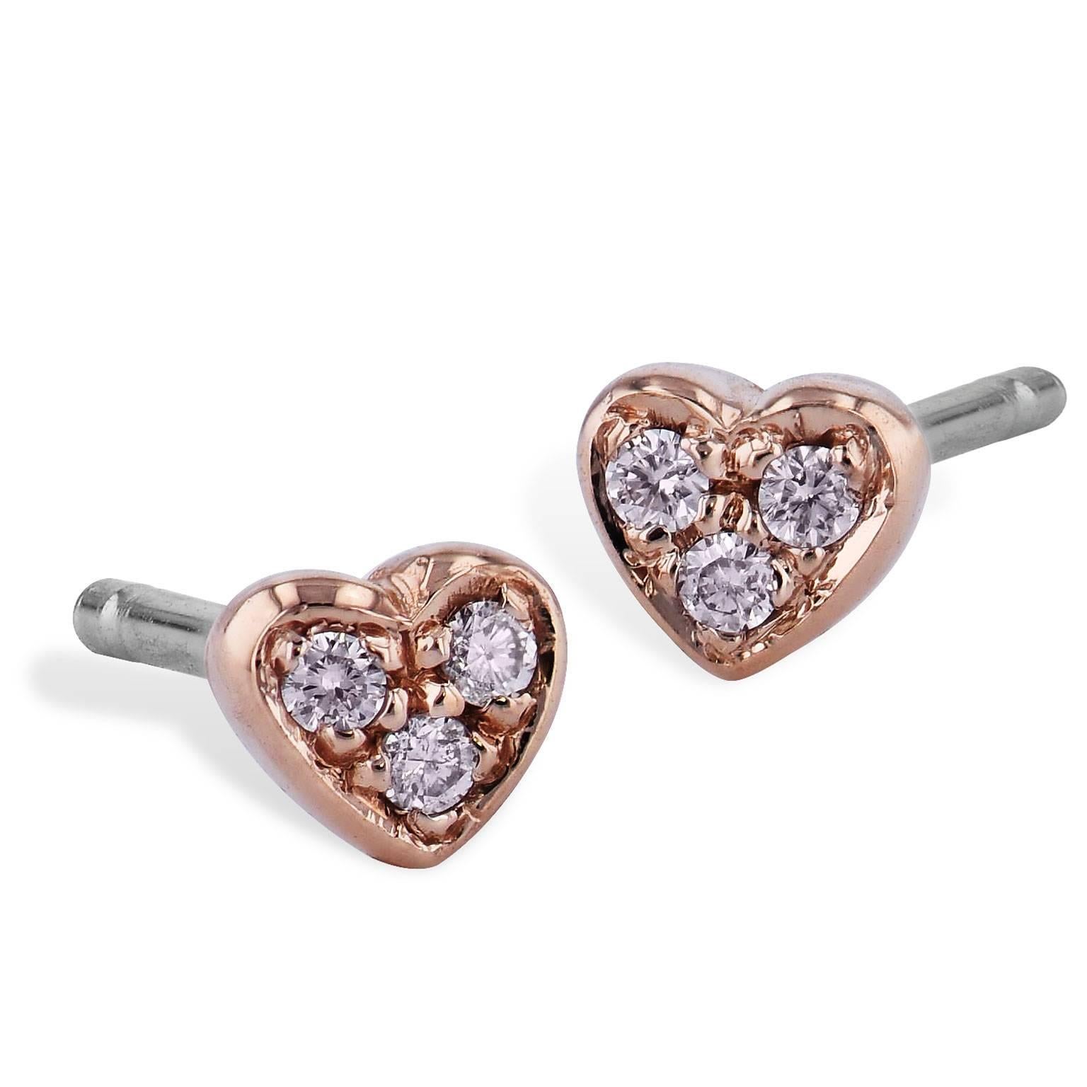 Simple and sweet, 0.05 carat of diamond (F/G/SI1/SI2) are pave-set in the shape of a heart in these handmade 14 karat rose gold baby stud earrings. Let a little bit of your love shine through with this pair of earrings